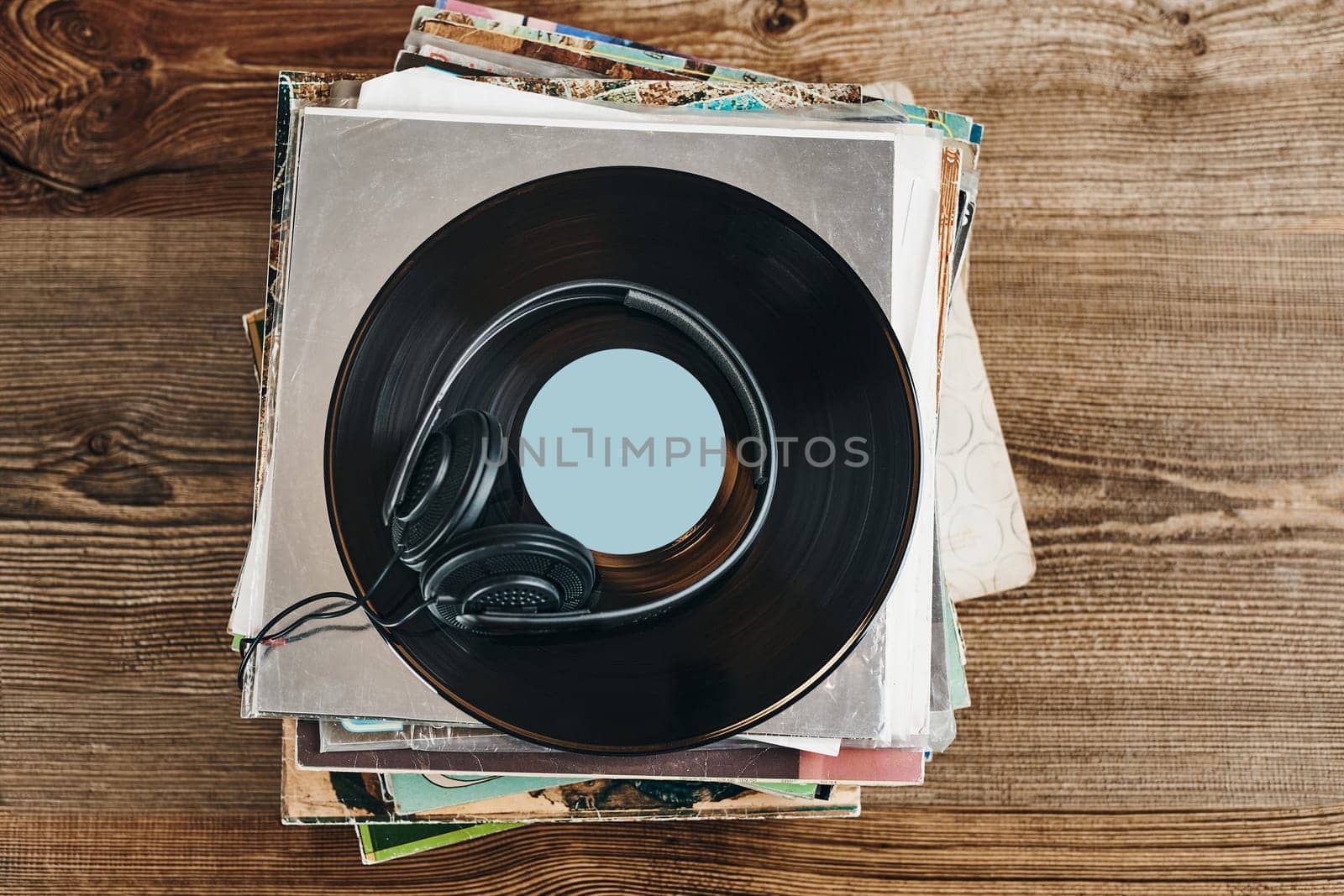 Stack of vinyl records. Listening to music from record. Playing music from analog disk. Retro and vintage. Audio stereo. Analog sound