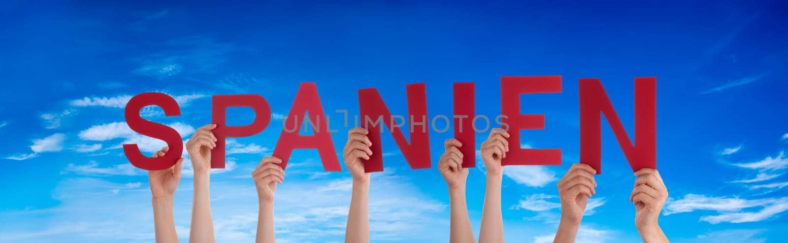 People Or Persons Hands Building German Word Spanien Means Spain. Summer Ocean, Sea And Beach As Background.