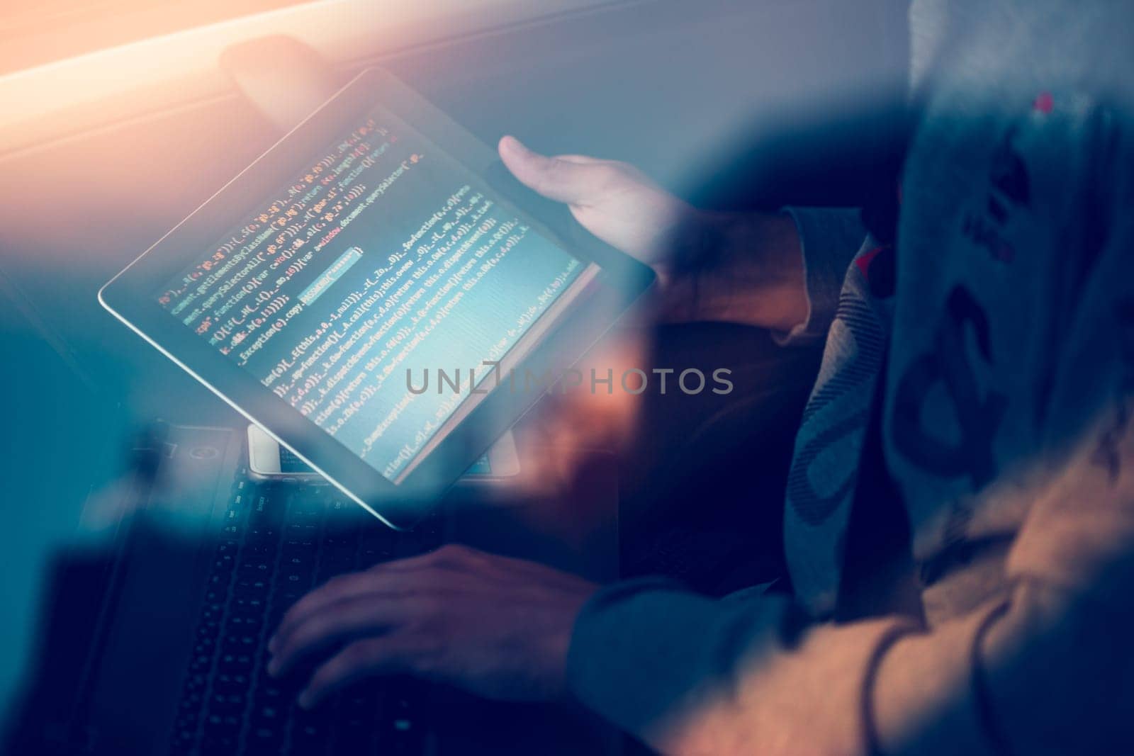 Hacker using computer, smartphone and coding to steal password and private data remotely from car. Screen displaying program code, website development, application building, password and private data