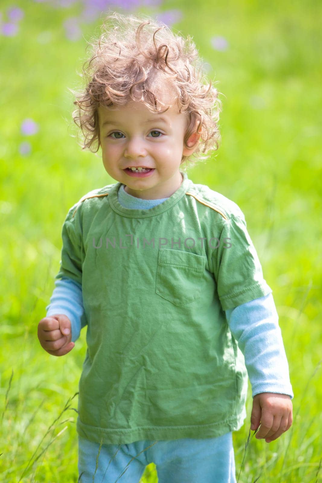 The portrait of a 1 and a half year old baby boy enjoying the outdoors.