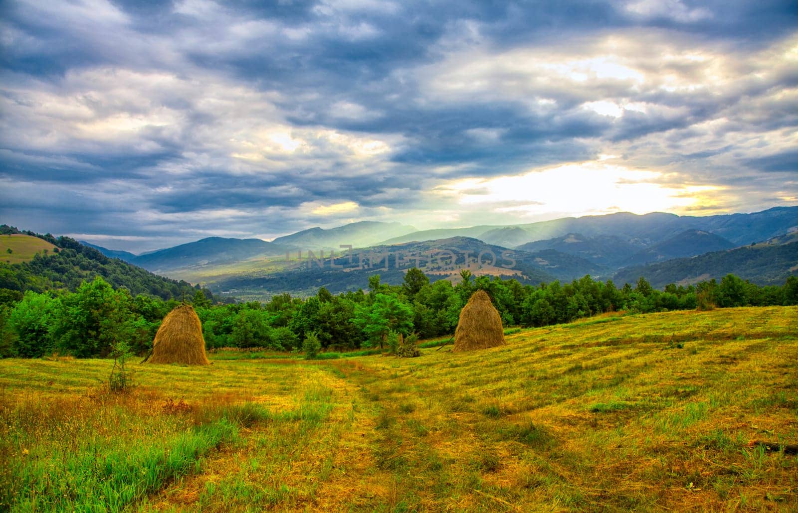 Picturesque landscape of the sunrise over Cernei Mountains seen from nearby Mehadia, Romania.
