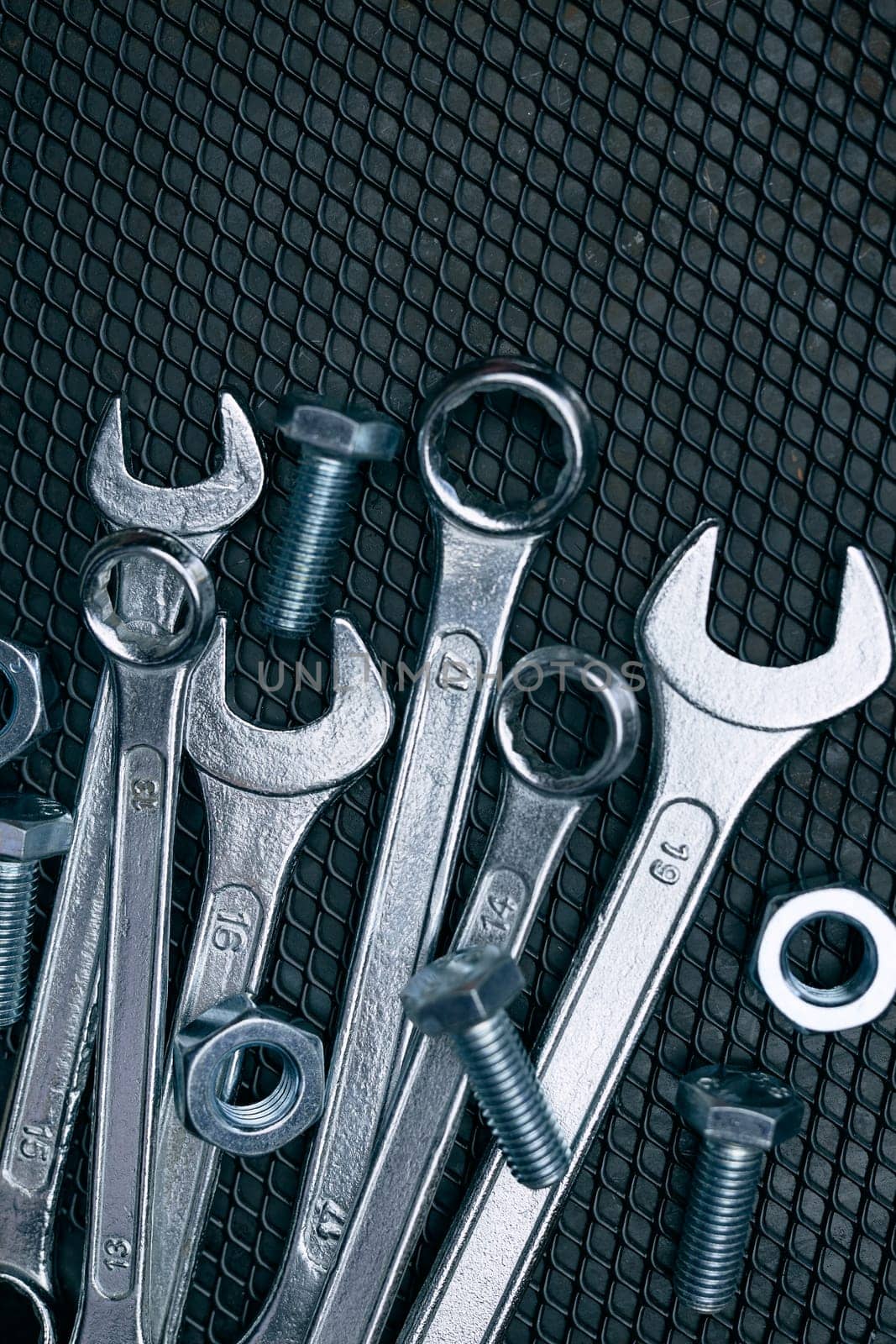 Set of chrome wrenches on steel surface. Mechanic tools for maintenance. Hardware tools to fix. Technical tools background