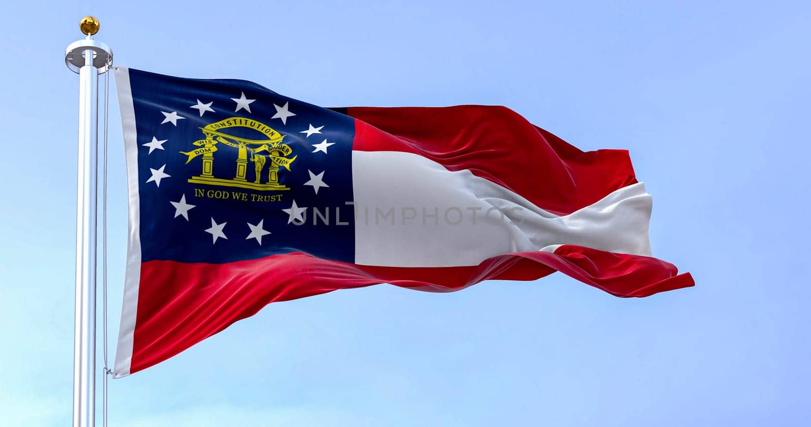 The state flag of Georgia waving in the wind on a clear day. Red, white, red stripes. Blue canton with 13 stars and coat of arms. 3d illustration render. Fluttering textile