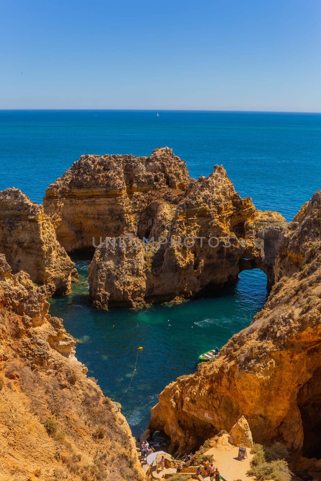 Lagos, Portugal - 25 August 2025: Tourists visiting Ponta da Piedade, in Lagos. Algarve, Portugal