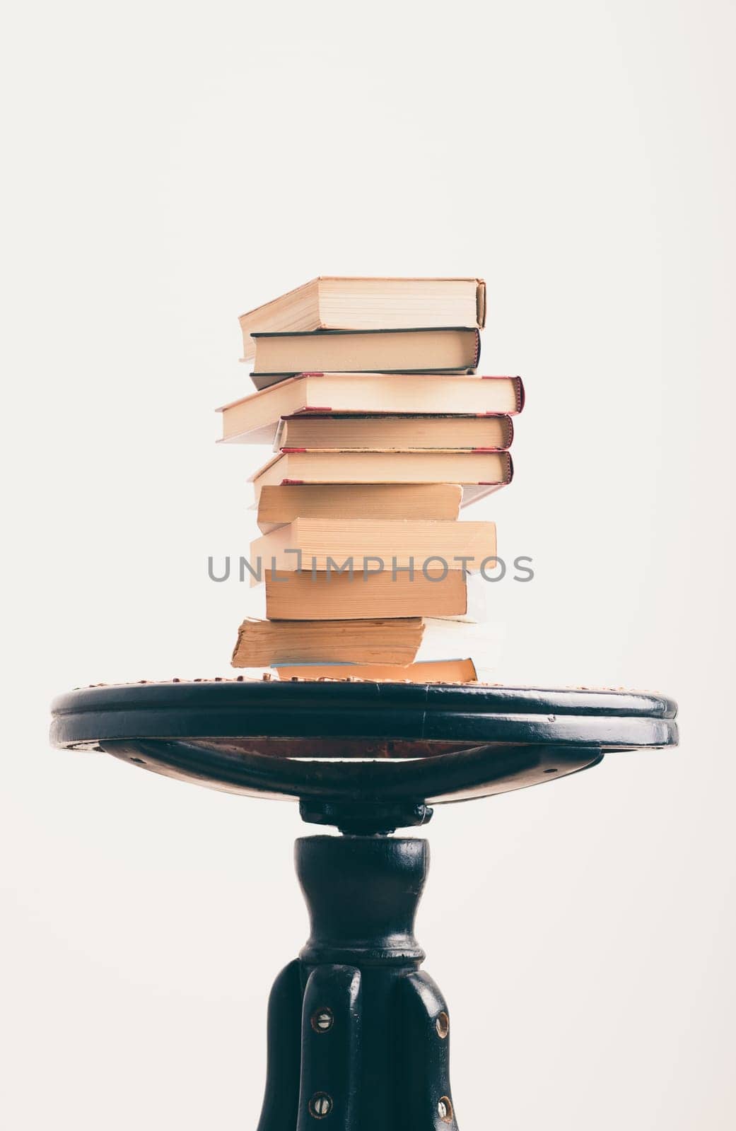 A few books with cup of coffee on chair