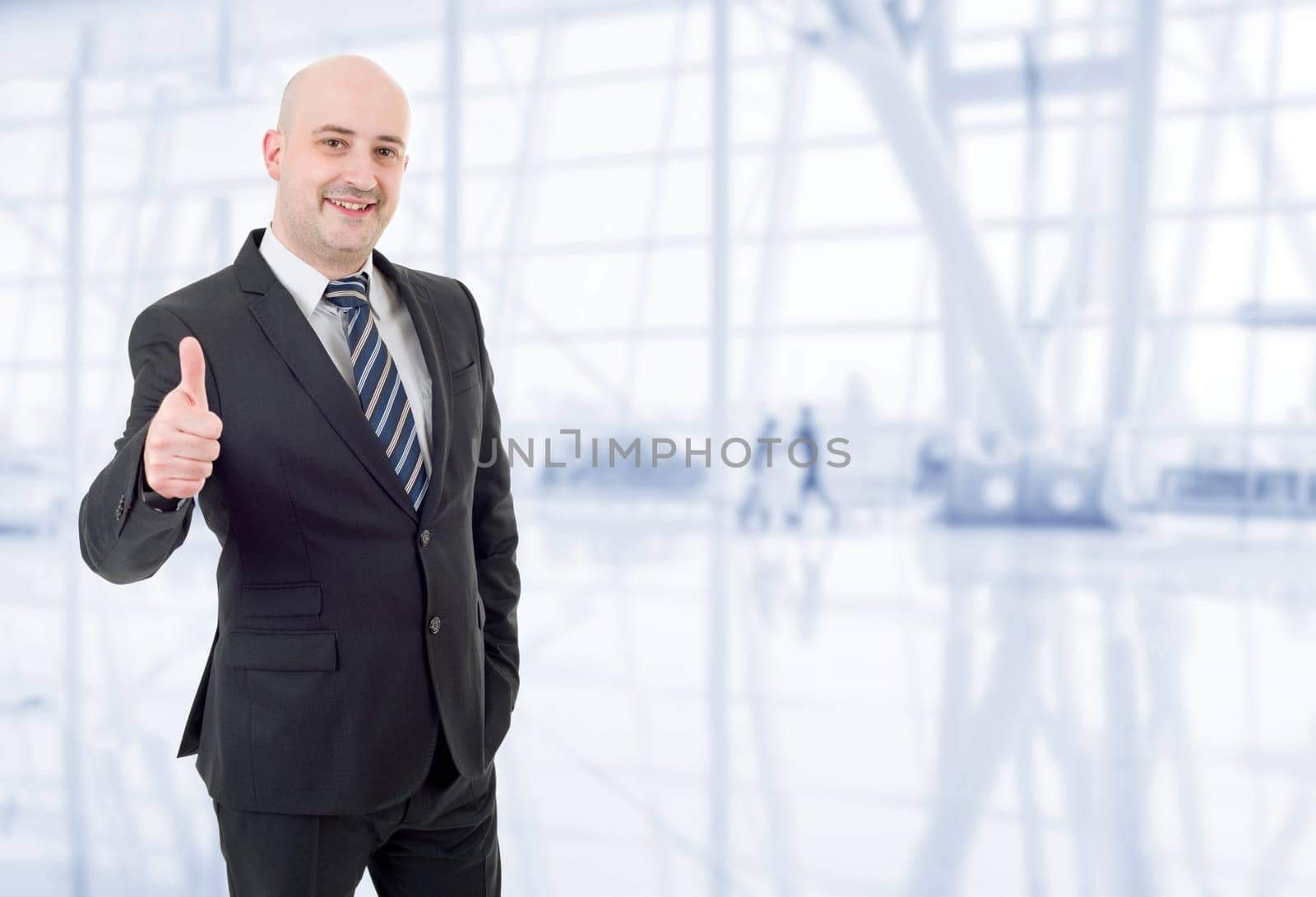 young business man going thumb up, at the office