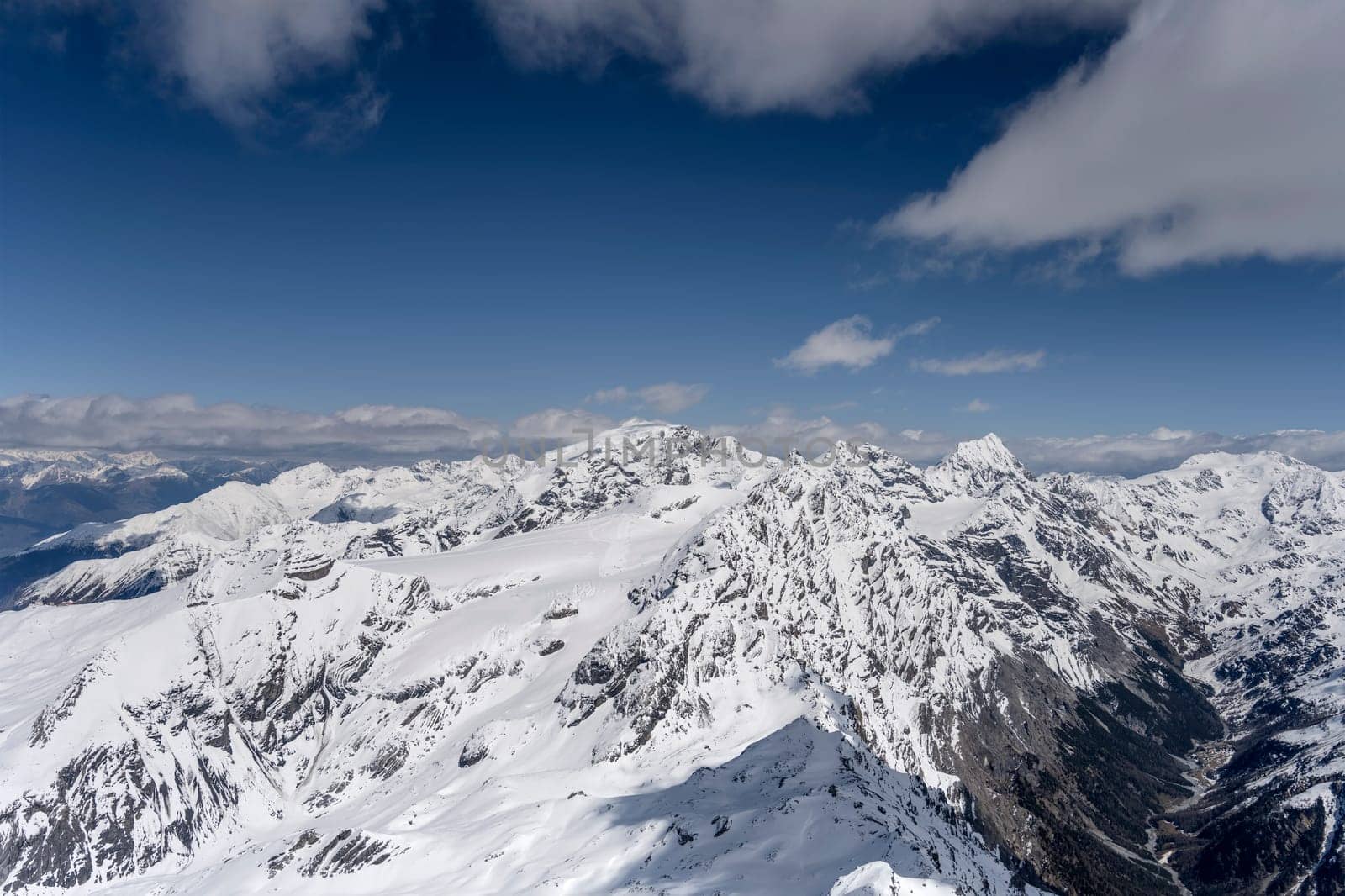 aerial landscape, from a glider plane, of Stelvio ski area and Zebru' valley, shot from west in bright late spring light, Sondrio, Italy