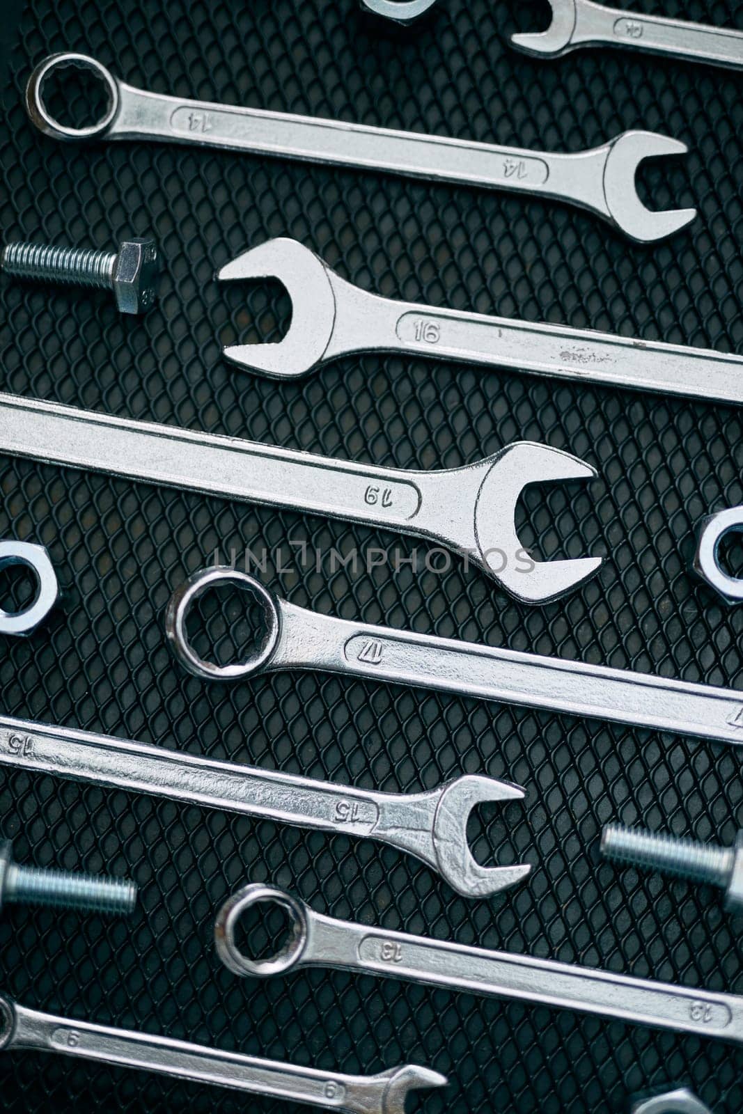 Set of chrome wrenches on steel surface. Mechanic tools for maintenance. Hardware tools to fix. Technical tools background