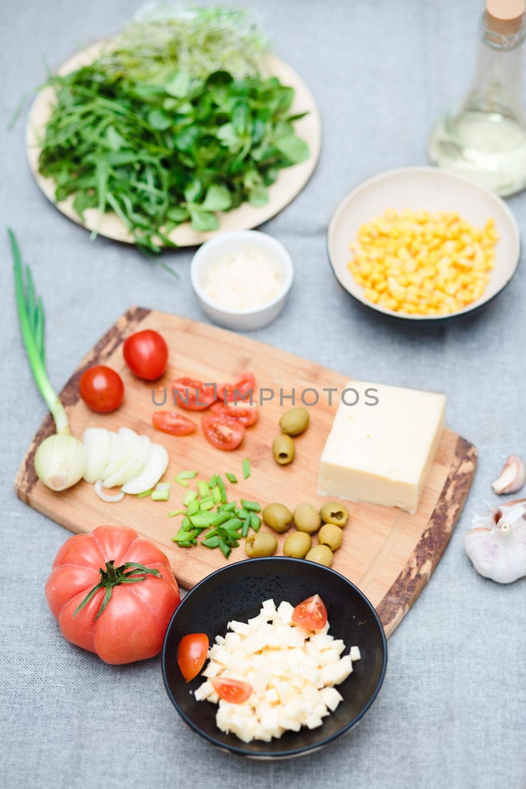 Preparing healthy snacks with fresh cheese and vegetables