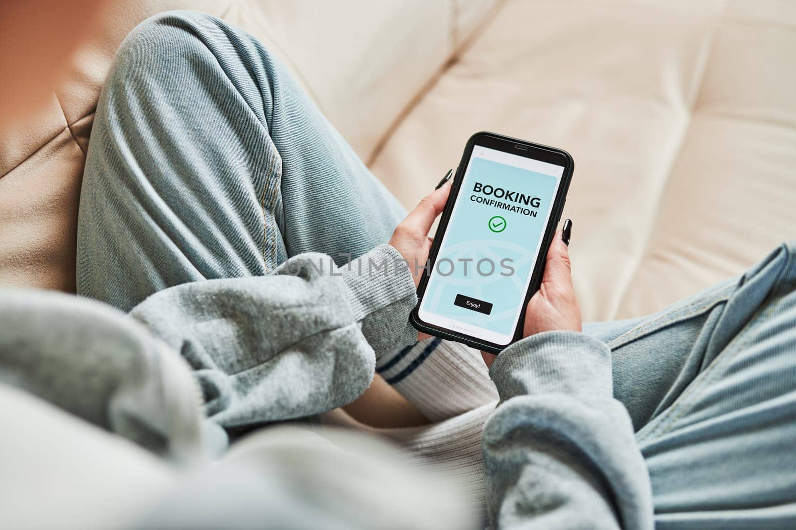 Woman booking vacation online. Person paying for hotel from home. Booking flight using mobile payment app. Purchasing service using smartphone. Online shopping from home. Order confirmation on screen