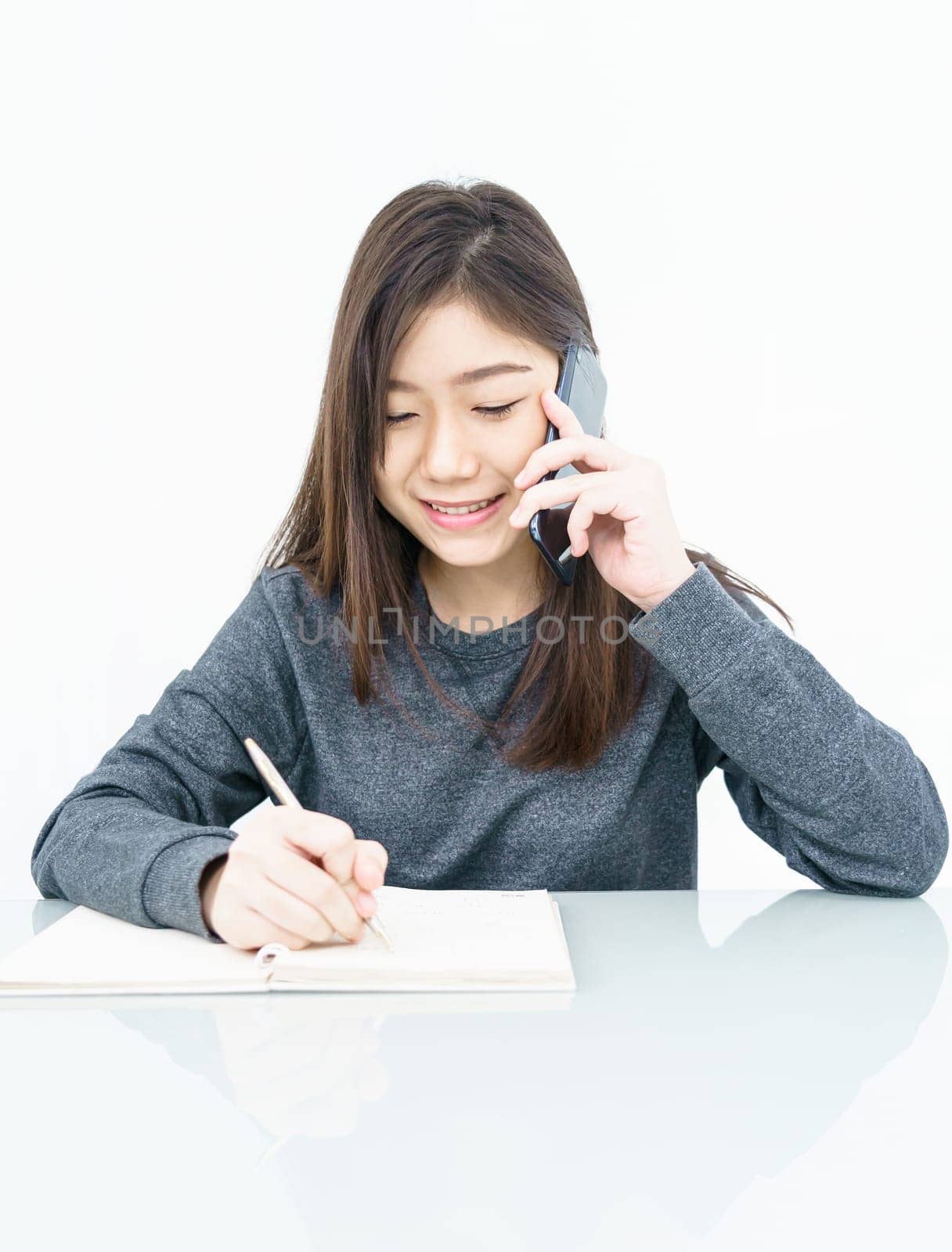 Woman long hair Woman using mobile phone and  writing notebook on white background