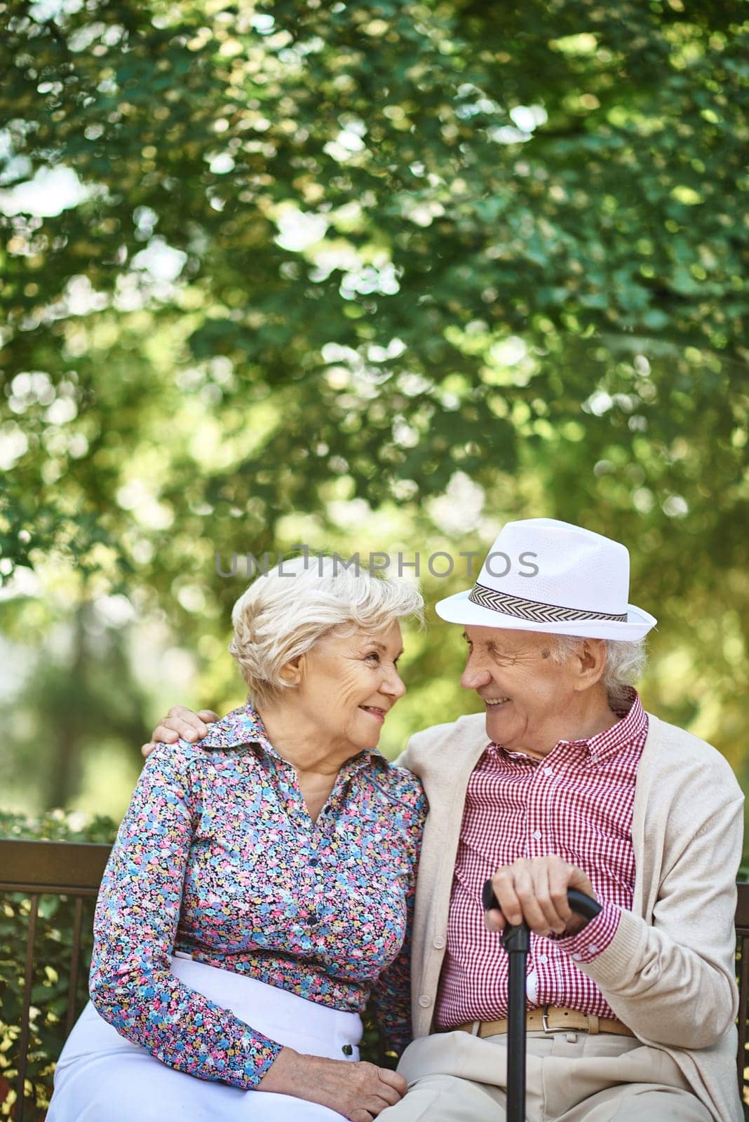Senior couple in smart casual interacting in urban environment