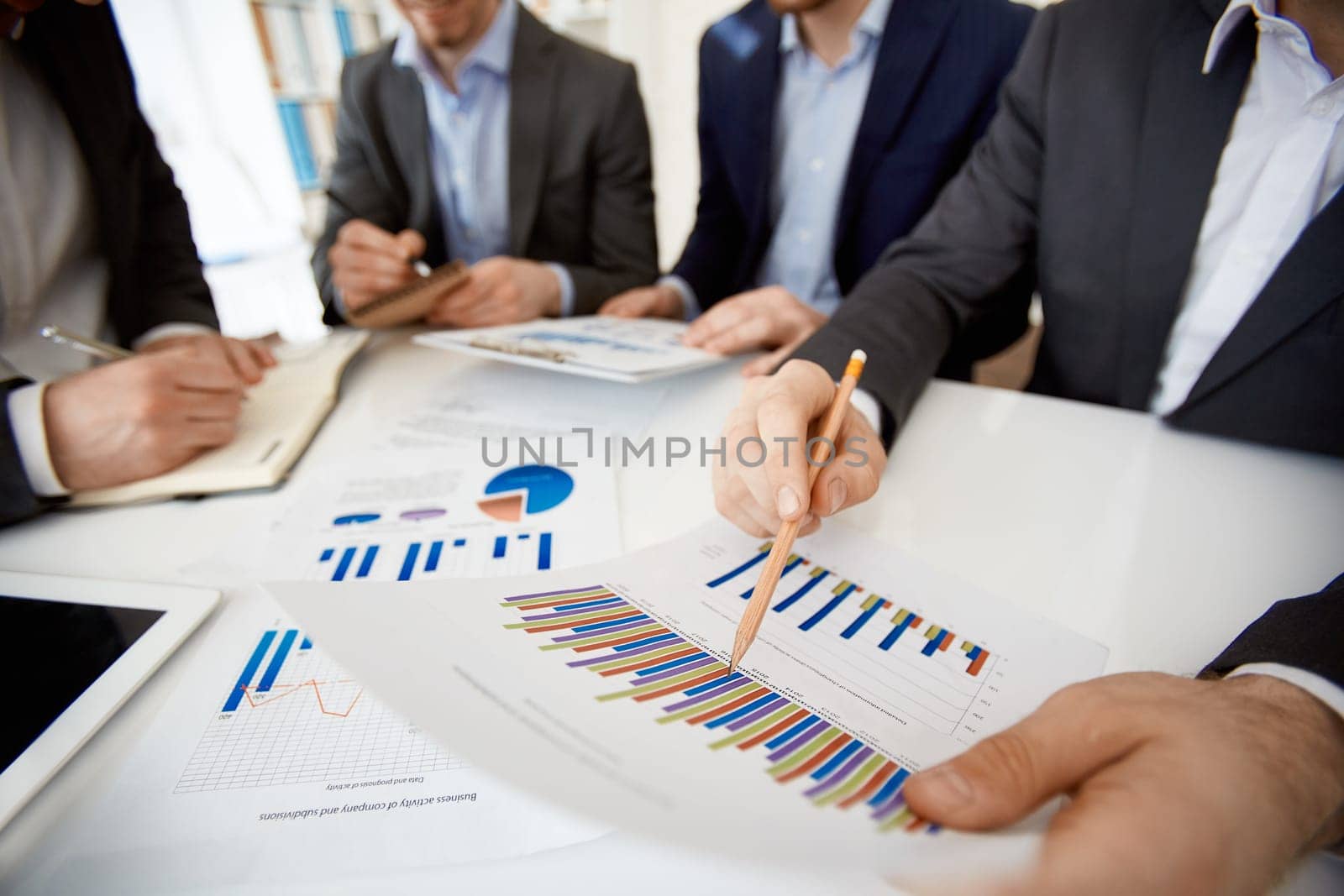 Businessman explaining financial results in chart