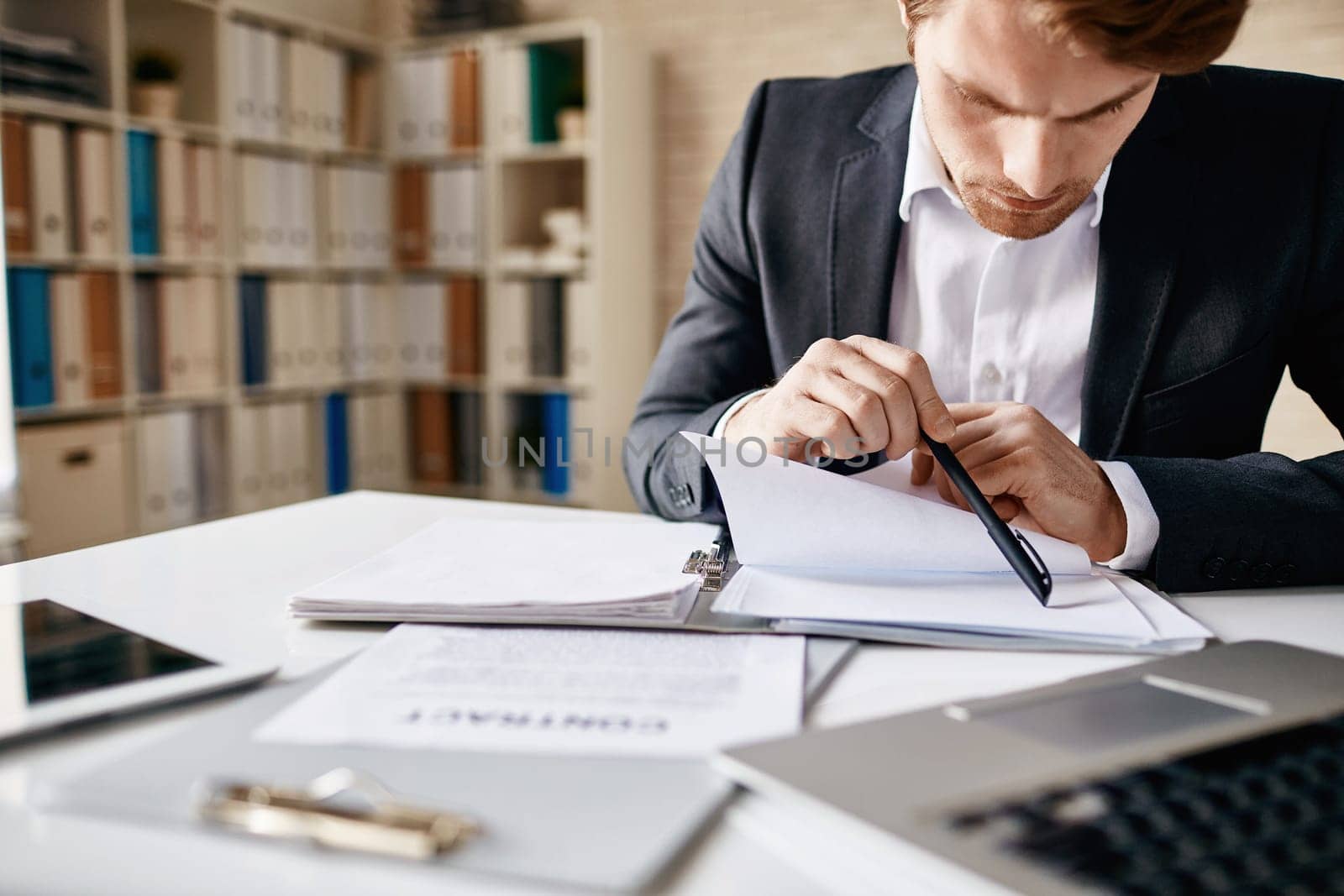 Businessman working with papers in office