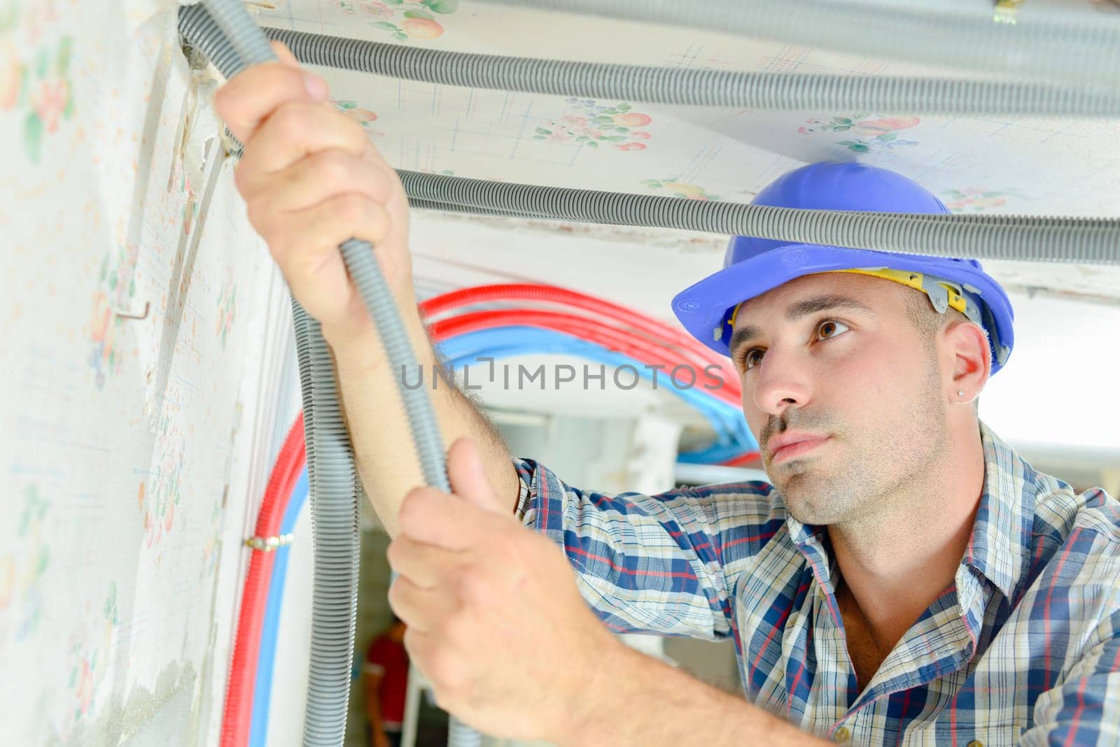 Electrician wiring a new house