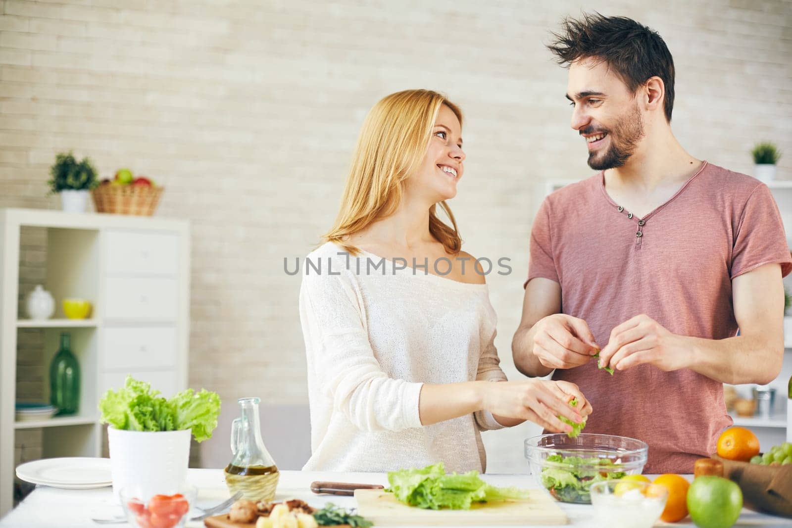 Young couple cooking breakfast together