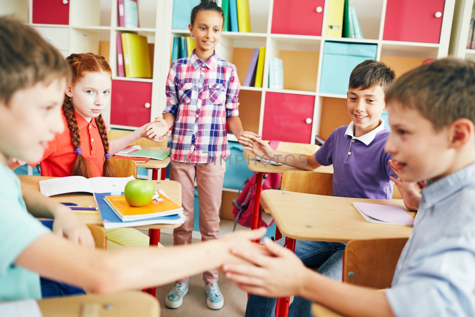 Friendly classmates playing at break between lessons