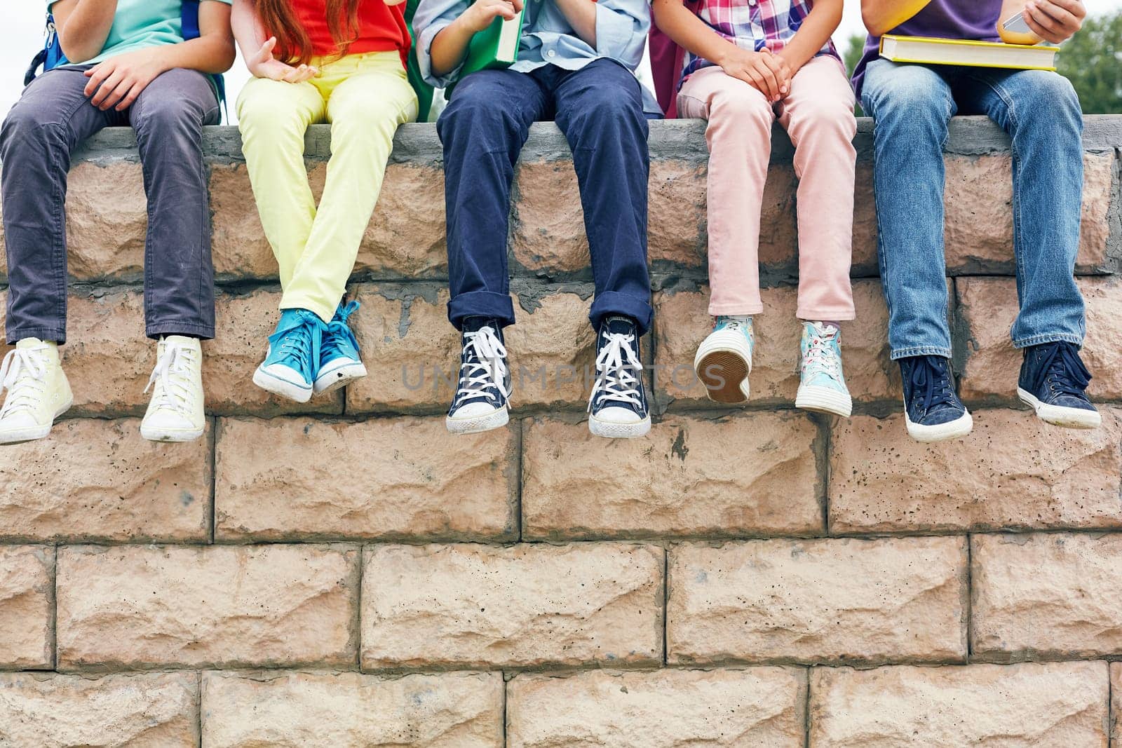 Row of successful learners looking at camera outside