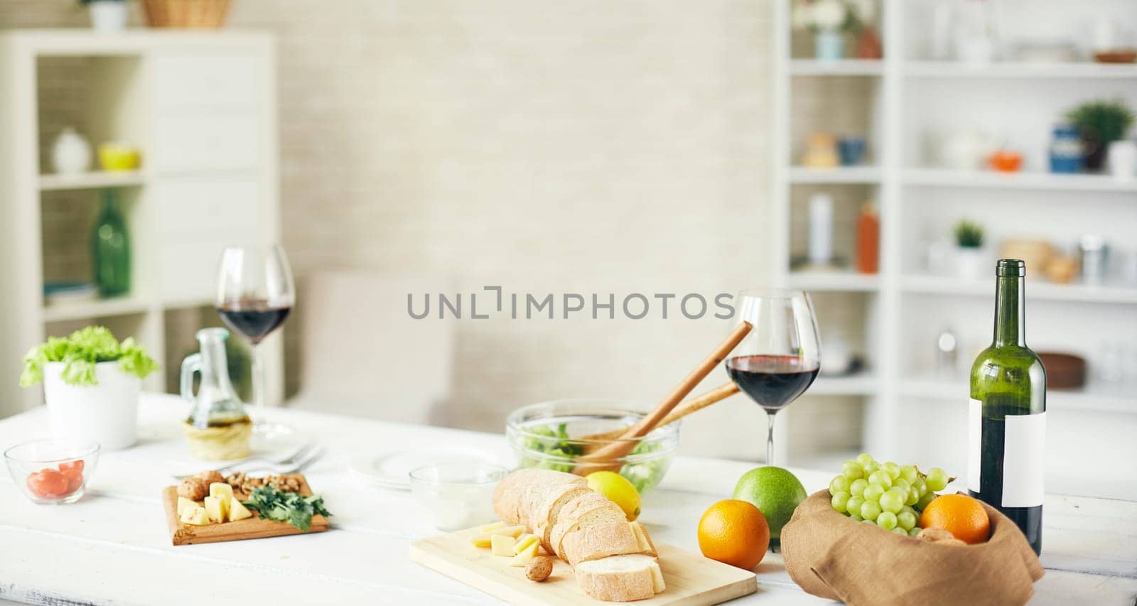 Fresh fruit, vegs, groceries and wine on the table