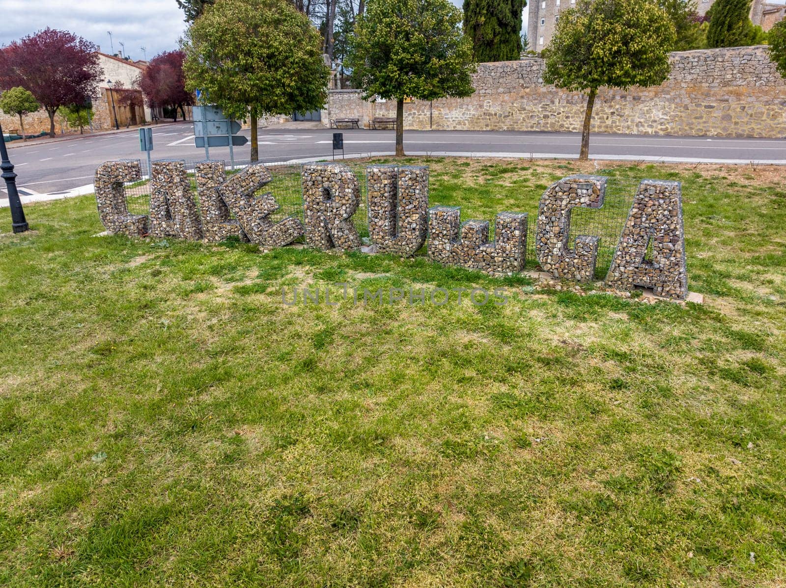 Caleruega , Spain - April 12, 2023 : Name of the town made with stones with the letters distributed in a nice way at the entrance of Caleruega, Burgos Spain