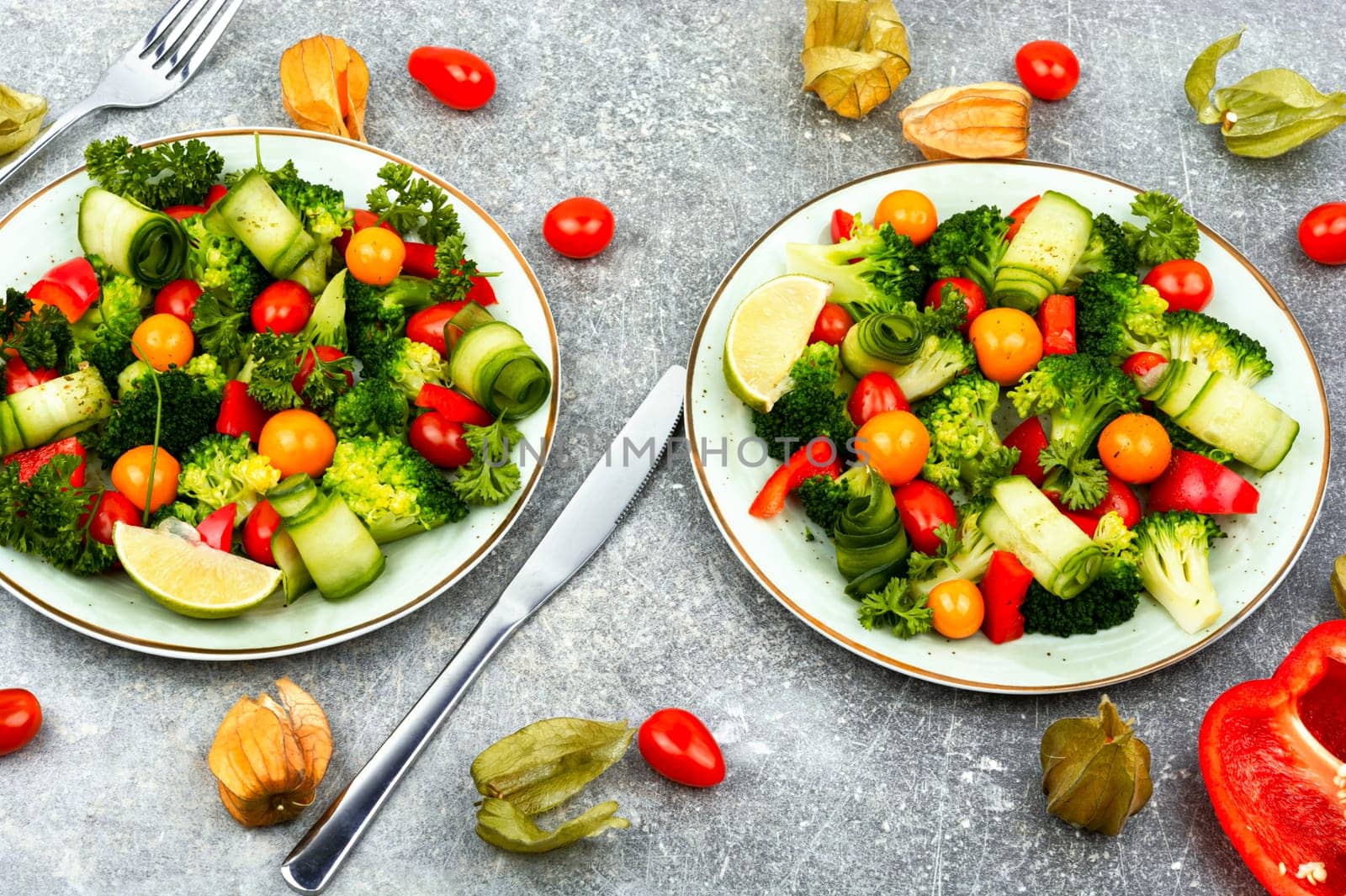 Bright dietary vegetable salad of cabbage, herbs and physalis. Healthy eating