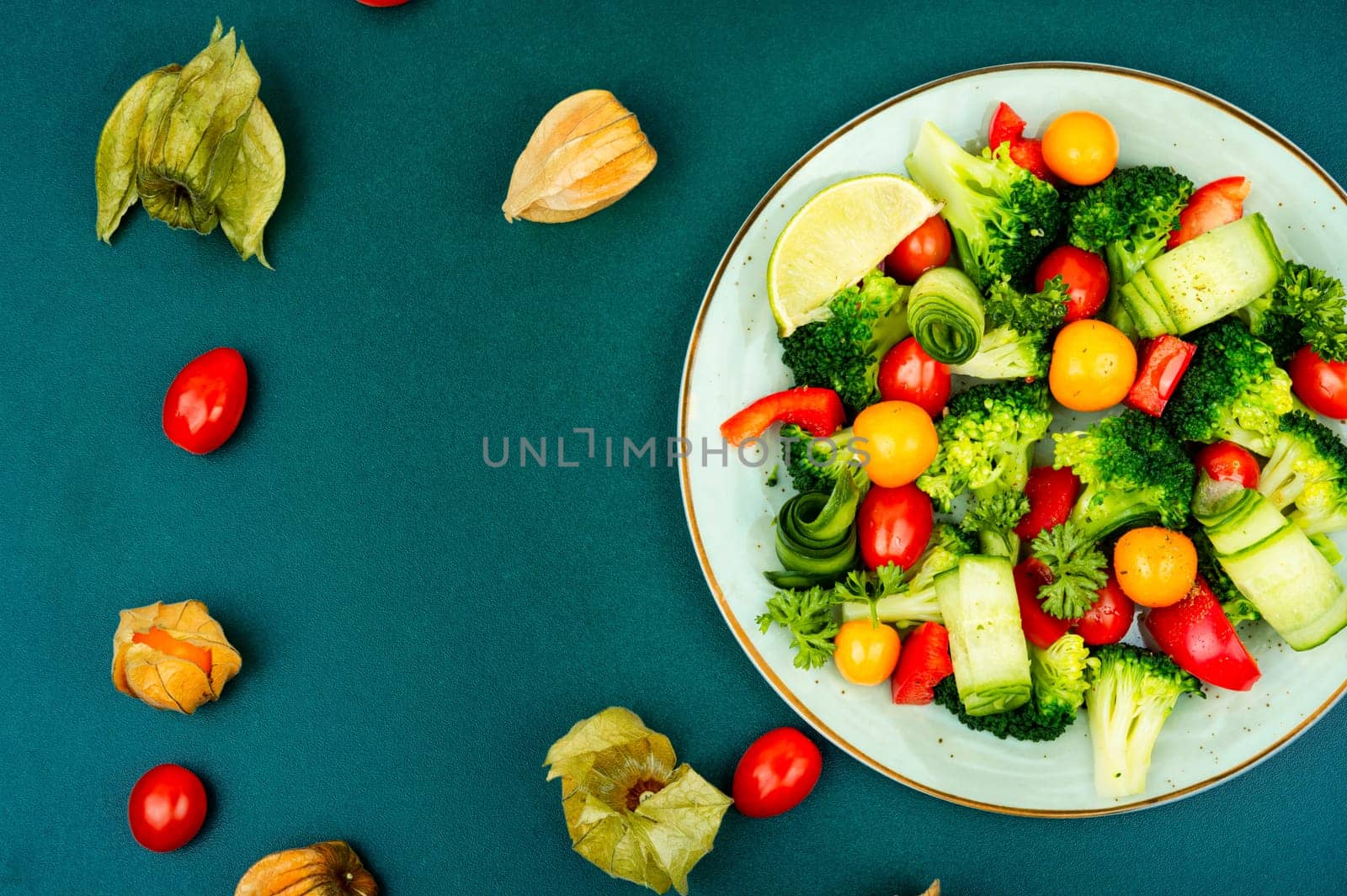 Bright dietary vegetable salad of cabbage, herbs and physalis. Healthy eating