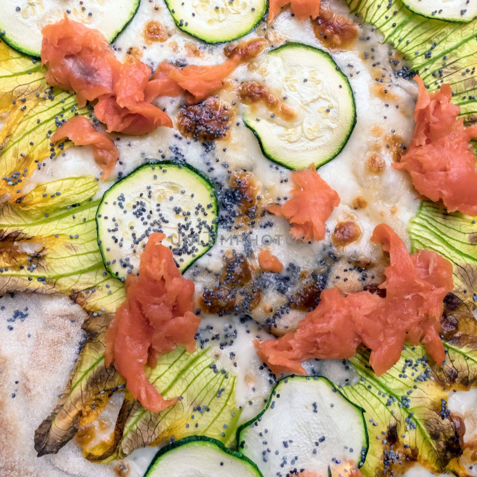 Pizza gourmet. Delicious pizza with salmon and vegetables. italian pizza. Background. Top view. Flat lay.