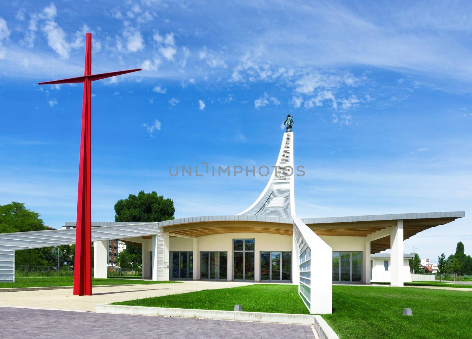 Modern church with a big red cross in Italy