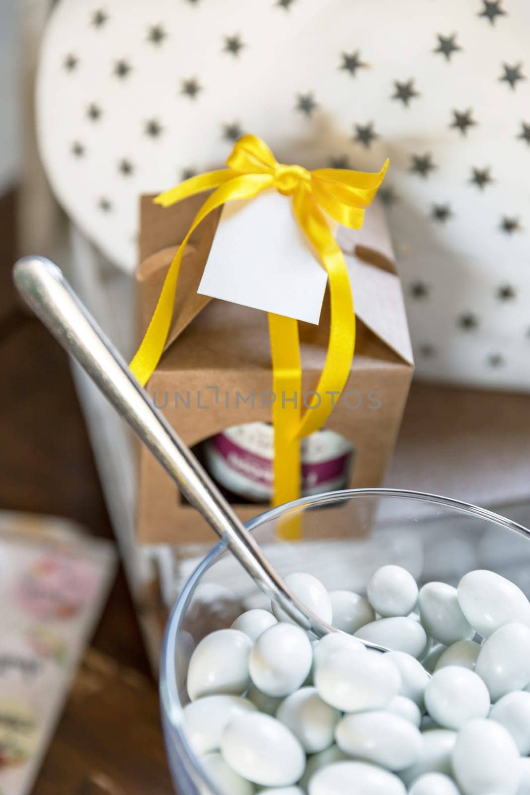 White sugared almonds in  glass cup. Wedding day. Party. Events.