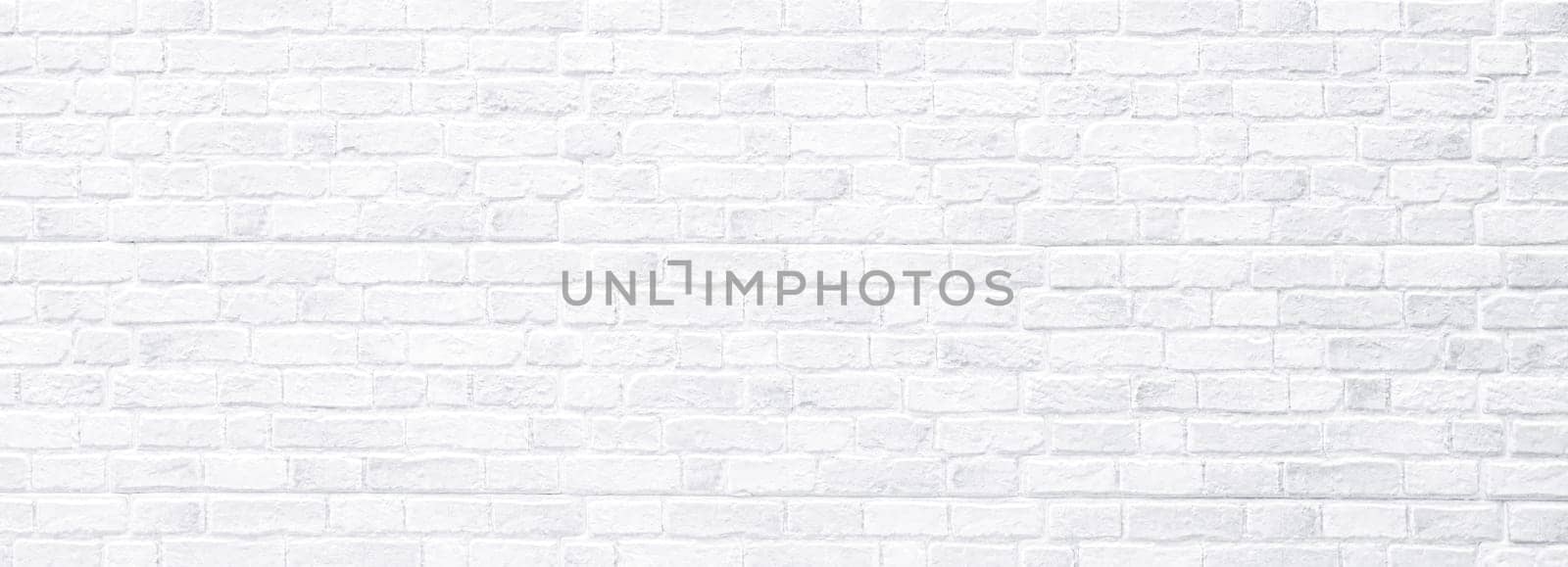 Brick wall, antique old grunge white texture wide panorama background.