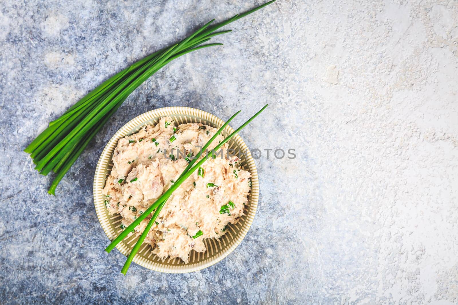 Healthy green soup with fresh spring plants, herbs, winter purslane, chives and ramson
