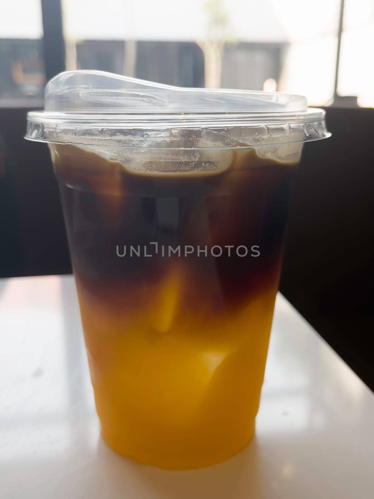A glass of iced black orange coffee, stock photo