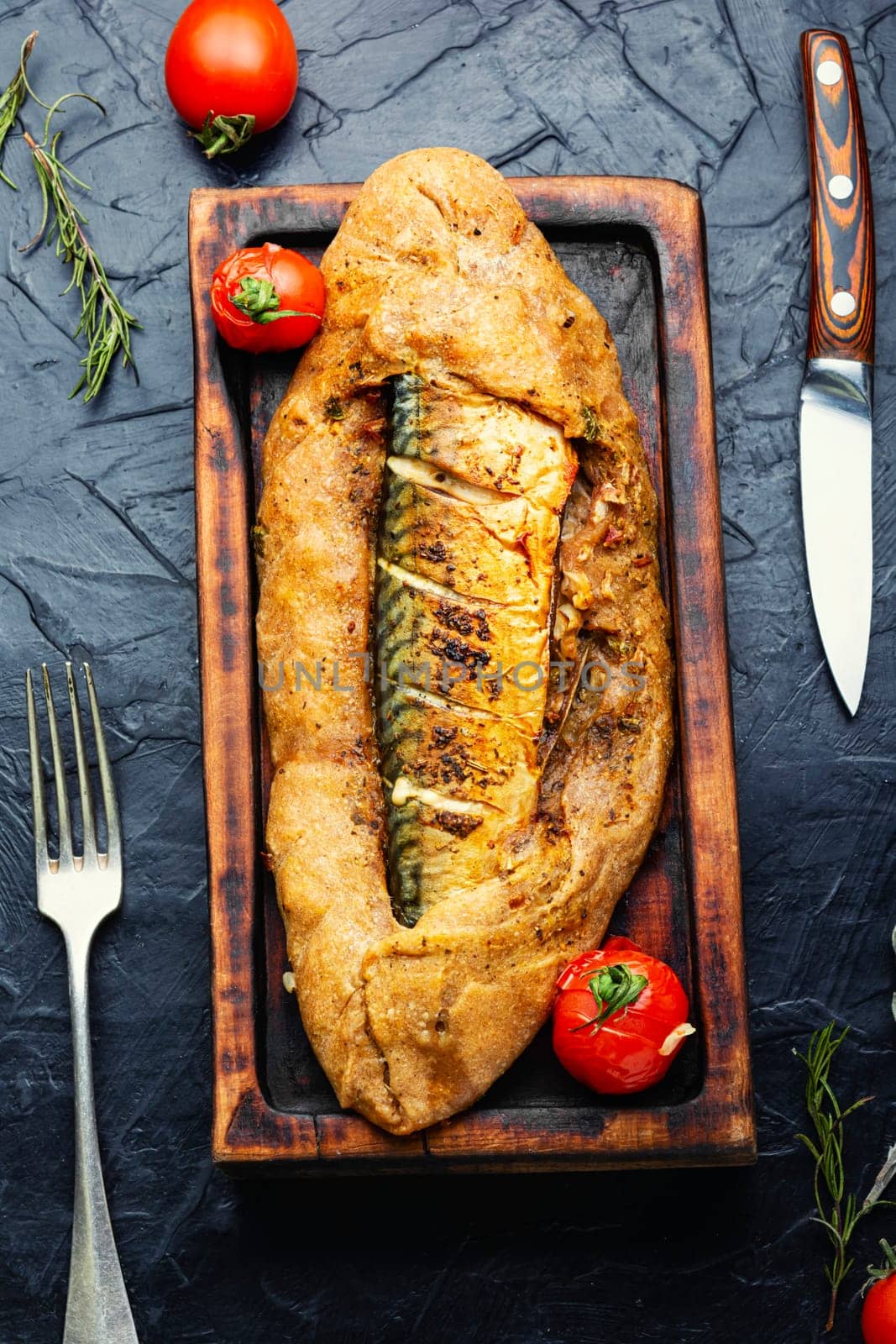Appetizer fish pie with scomber or mackerel on a concrete kitchen table. Top view