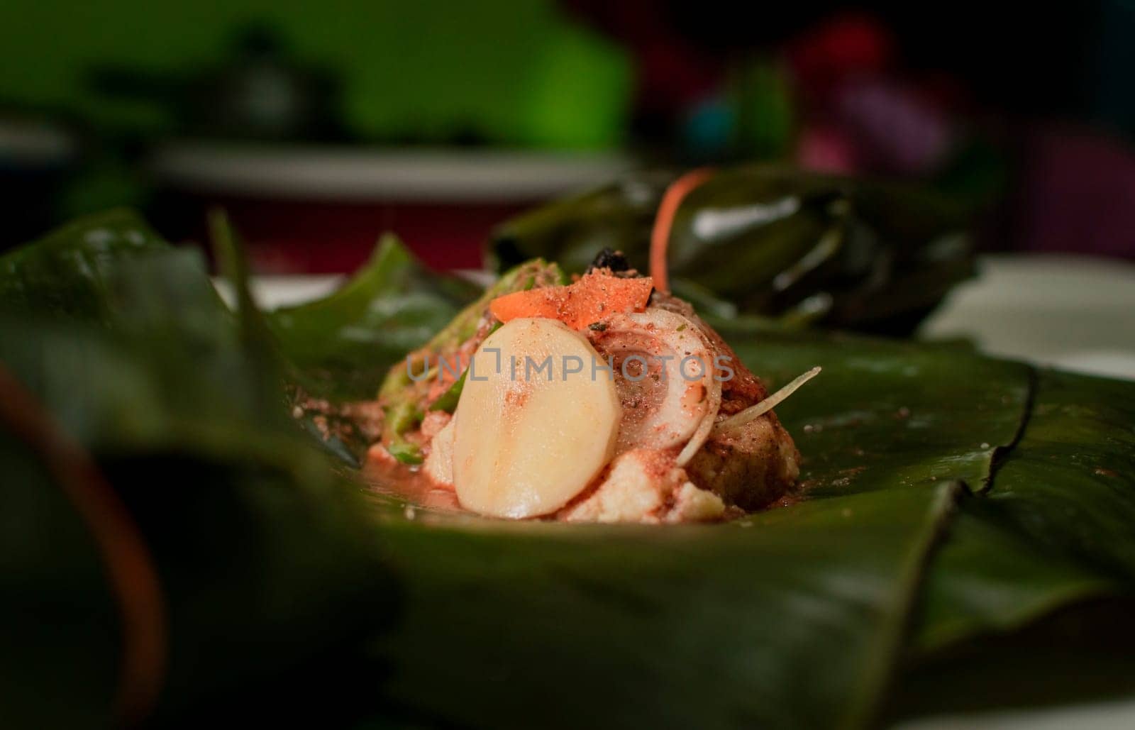 Nacatamal ingredients on banana leaves, Closeup of raw ingredients for the elaboration of a Nicaraguan nacatamal. Preparation of the traditional Nacatamal on banana leaves