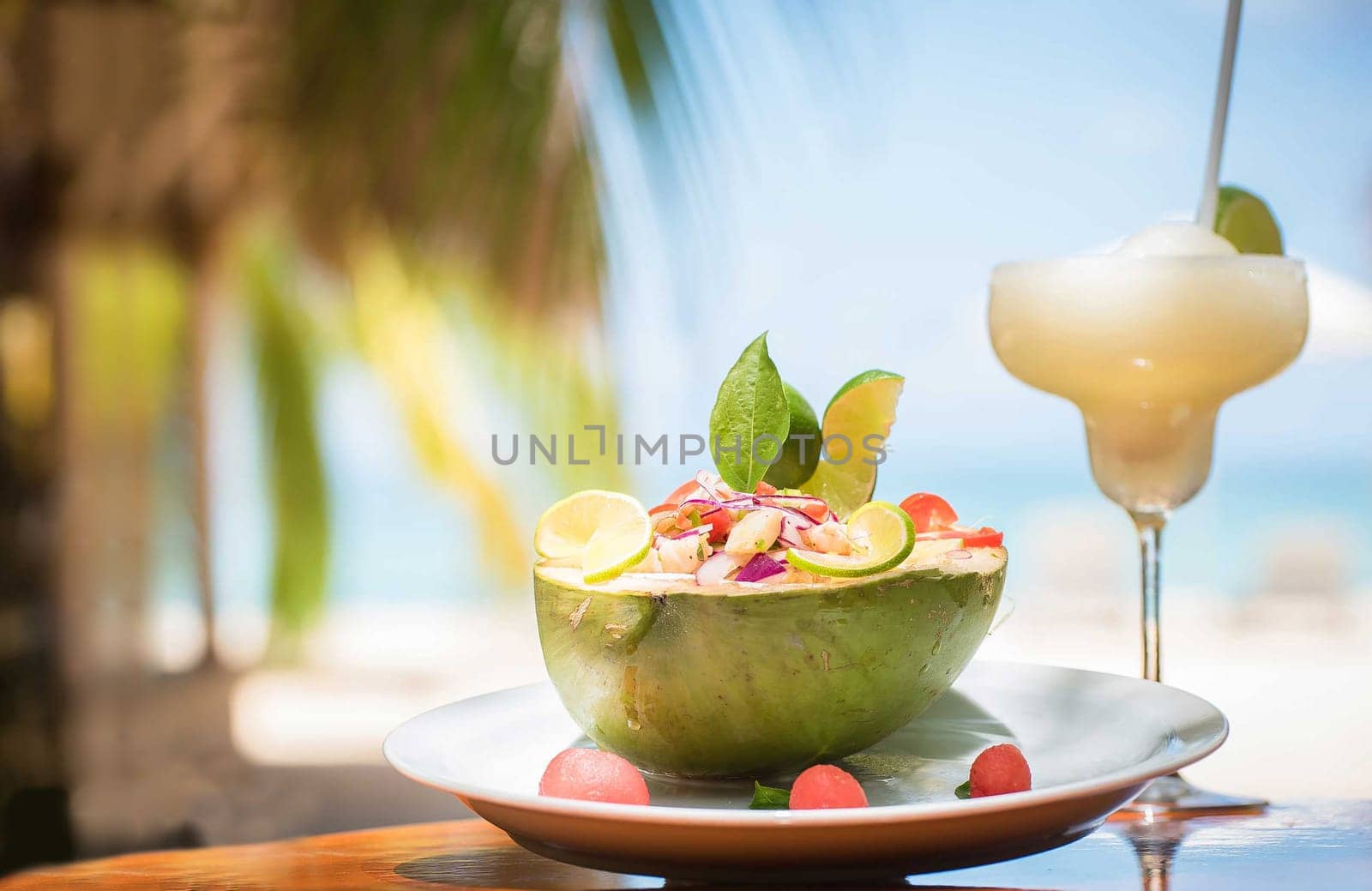 Nicaraguan food of a coconut with ceviche and fruit drink