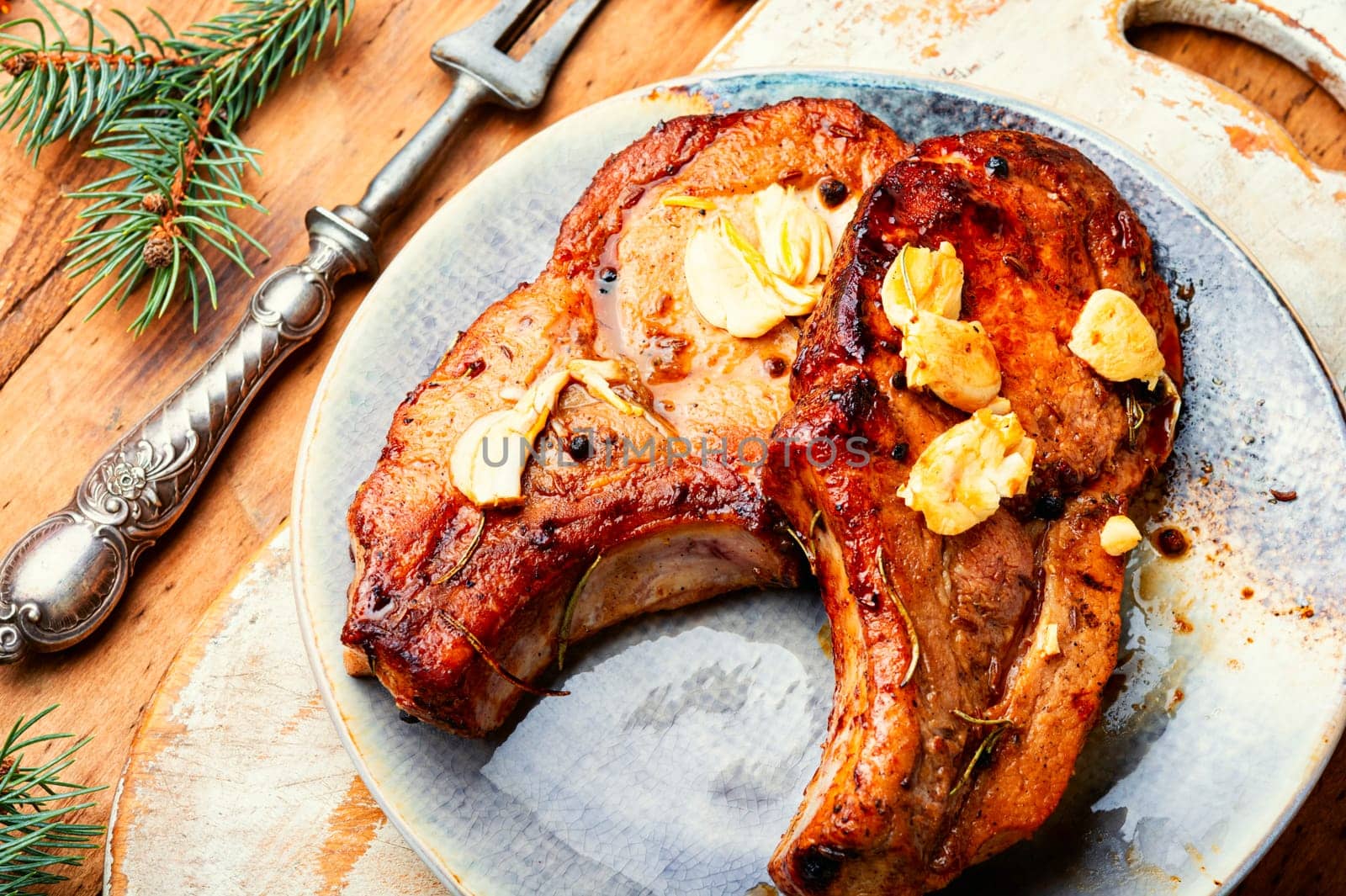 Delicious meat steak in the Christmas. Meat dish on New Year's festive table.