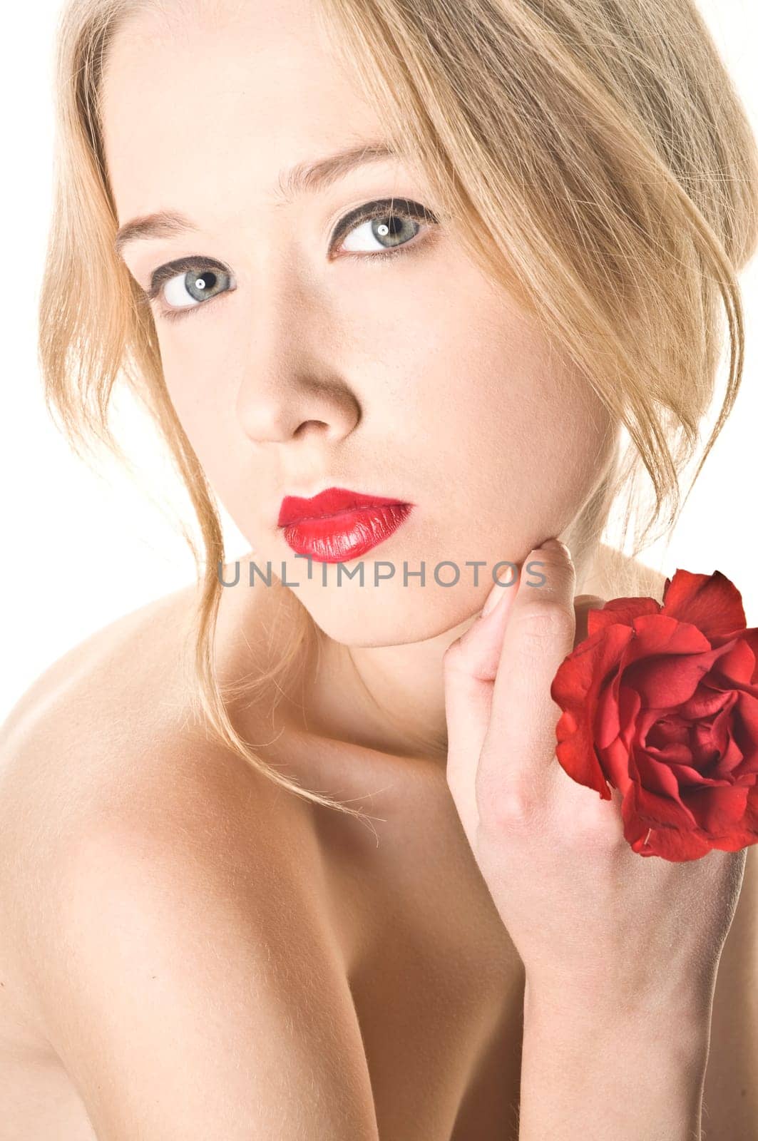 Beauty women portrait with red rose on white