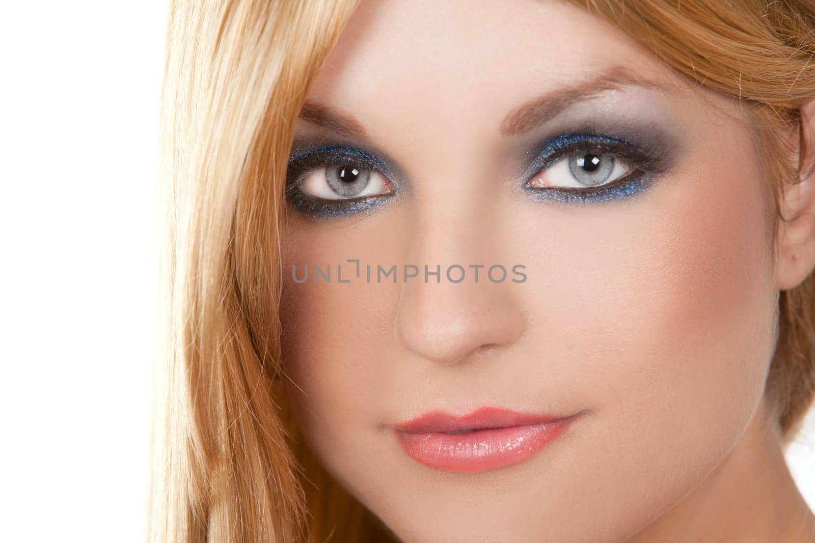 pretty blond woman with colorful makeup on white background