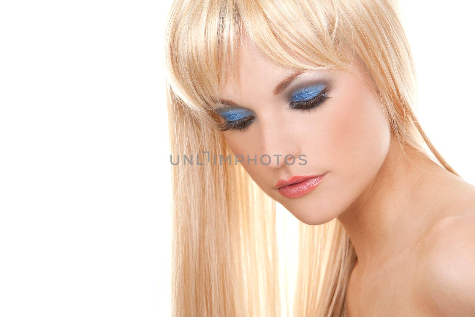 pretty blond woman with colorful makeup on white background