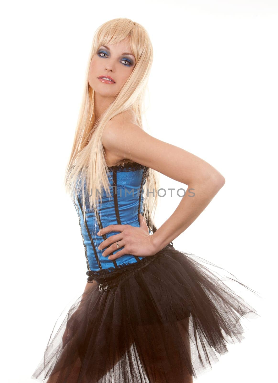 pretty blond woman wearing corset and black skirt on white background