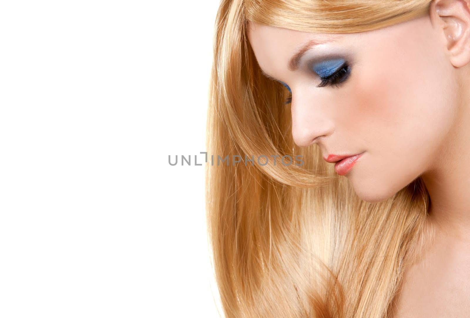 pretty blond woman with colorful makeup on white background
