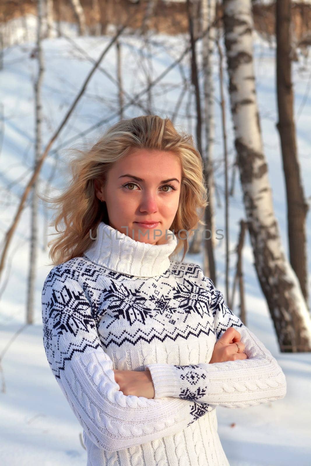 Beautiful young woman in winter clothes outdoor in forest