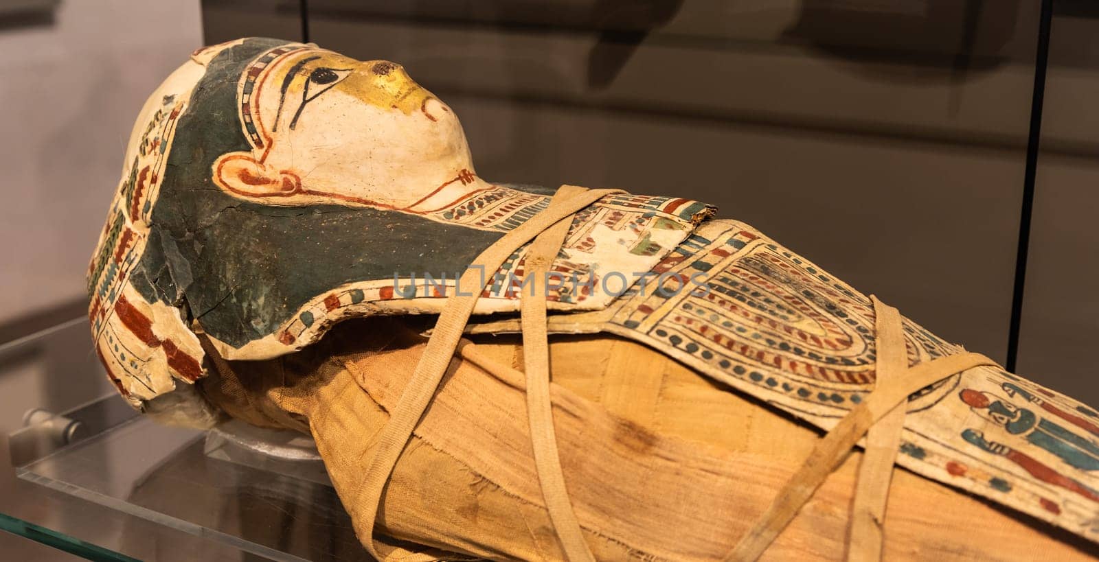 Turin, Italy - March 2023: Egyptian Museum, mummy of a baby with a mask - 2nd Century BC