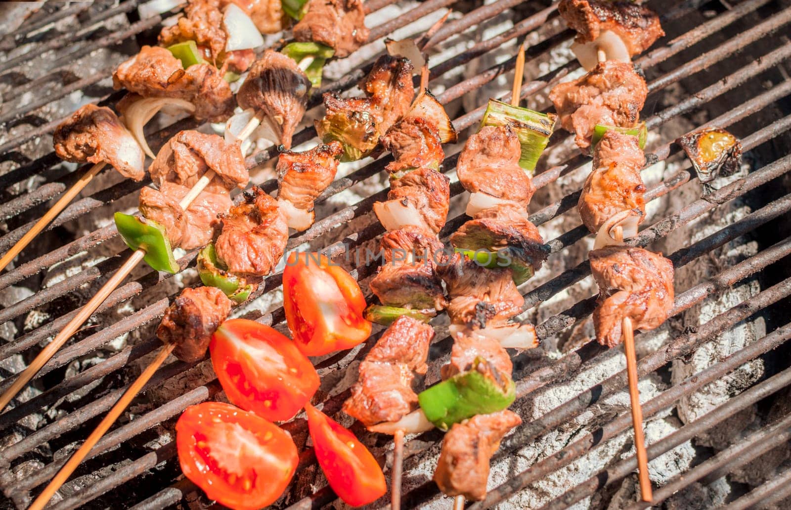 Roast beef skewers on a grill, Roast beef skewers grilling on a grill, Roast beef concept