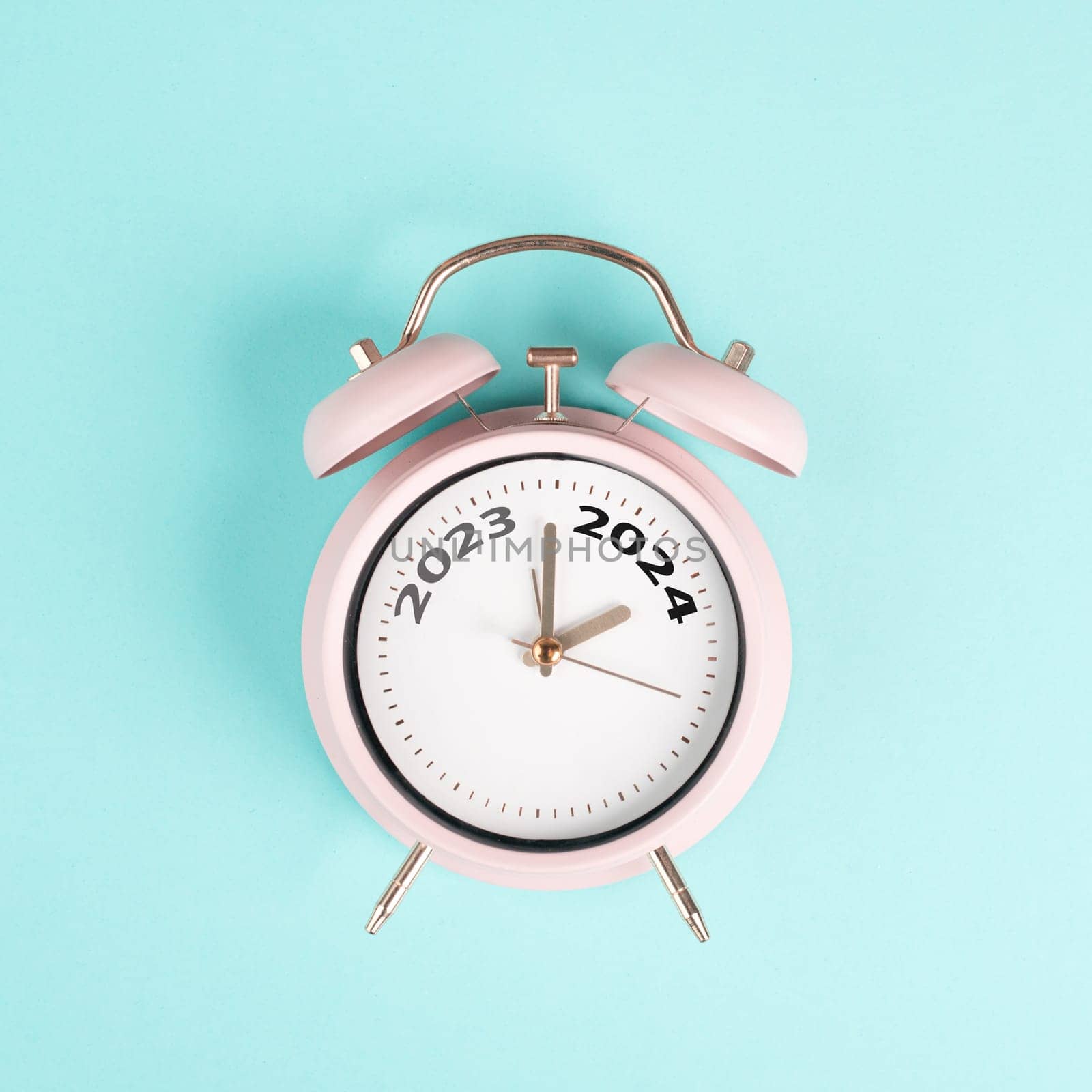 New year 2024 is loading, calendar date on an alarm clock, end of the year, changing time