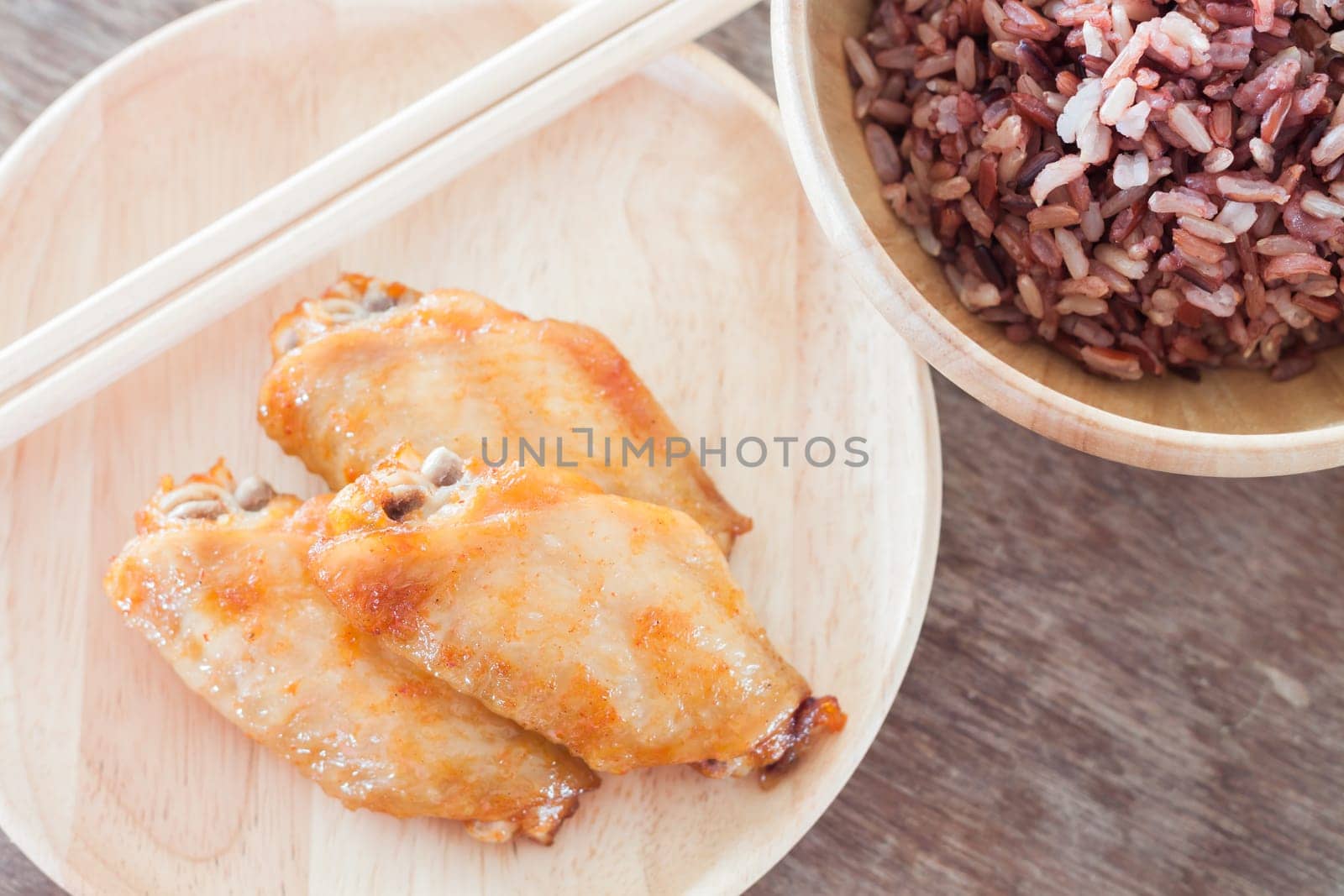 Grilled chicken wings with multi grains berry rice, stock photo