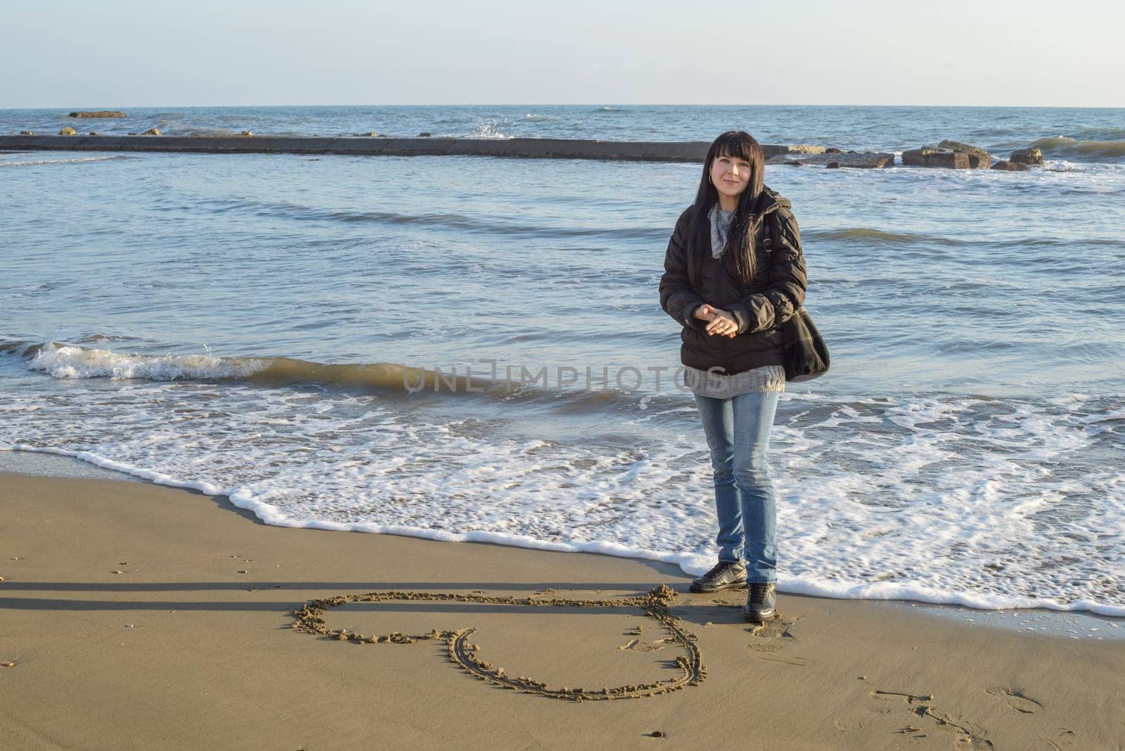 A portrait of a nice girl to the seaside in winter