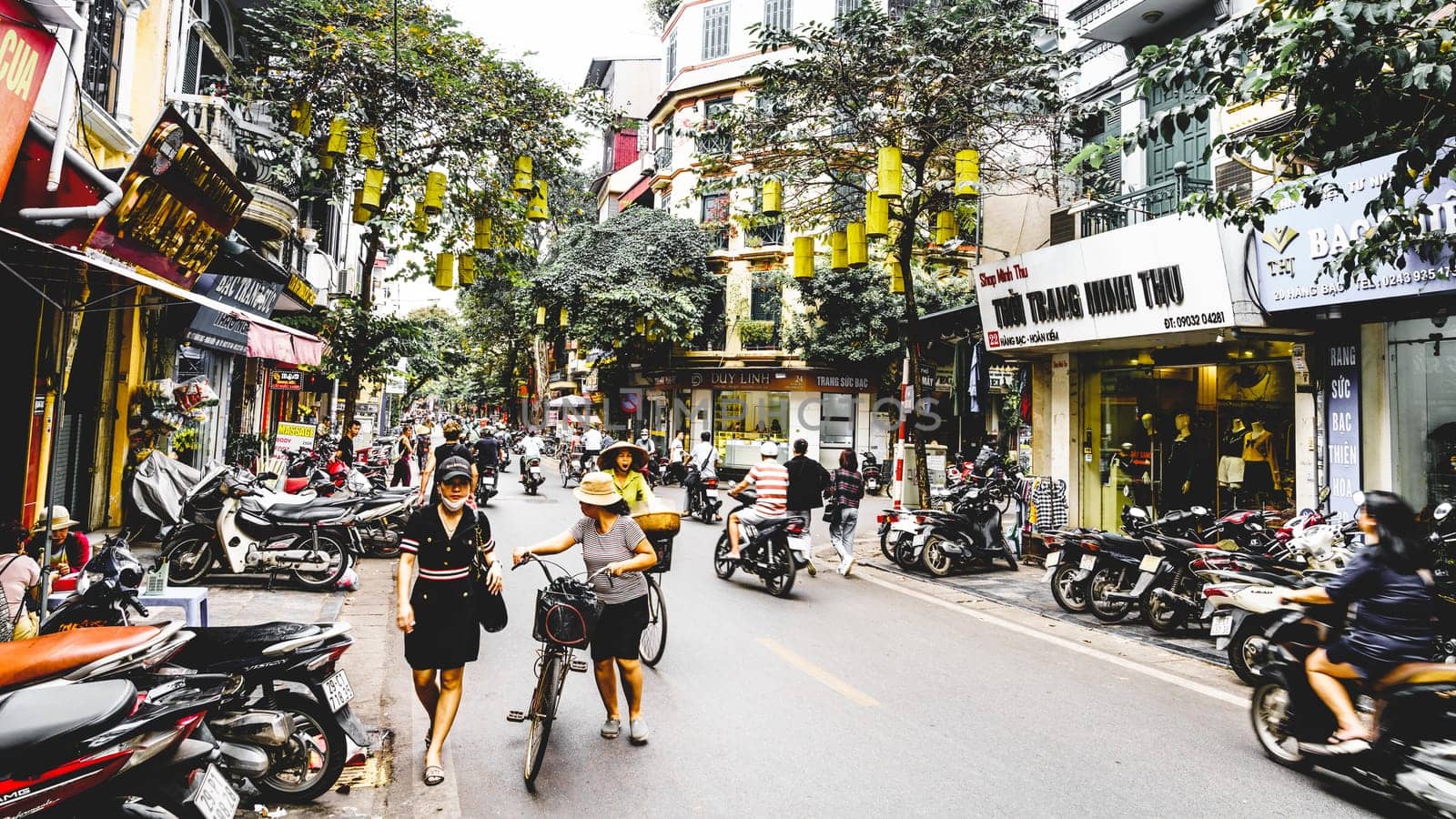Hanoi, Vietnam, November 15, 2022: Busy steet scene in French Quarter of Hanoi.