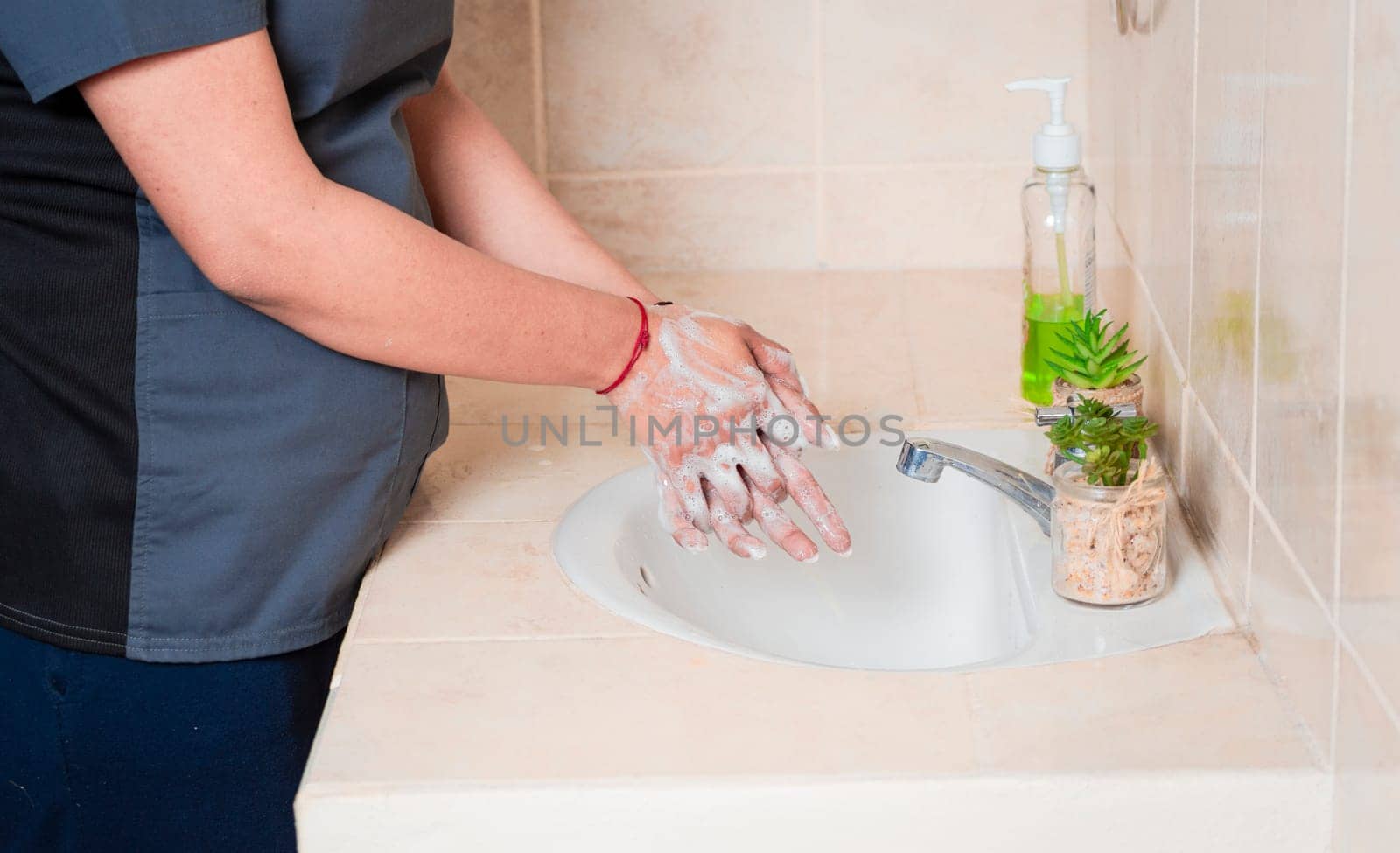 Close up of a person washing their hands with soap, concept of correct hand washing, ways to prevent covid19