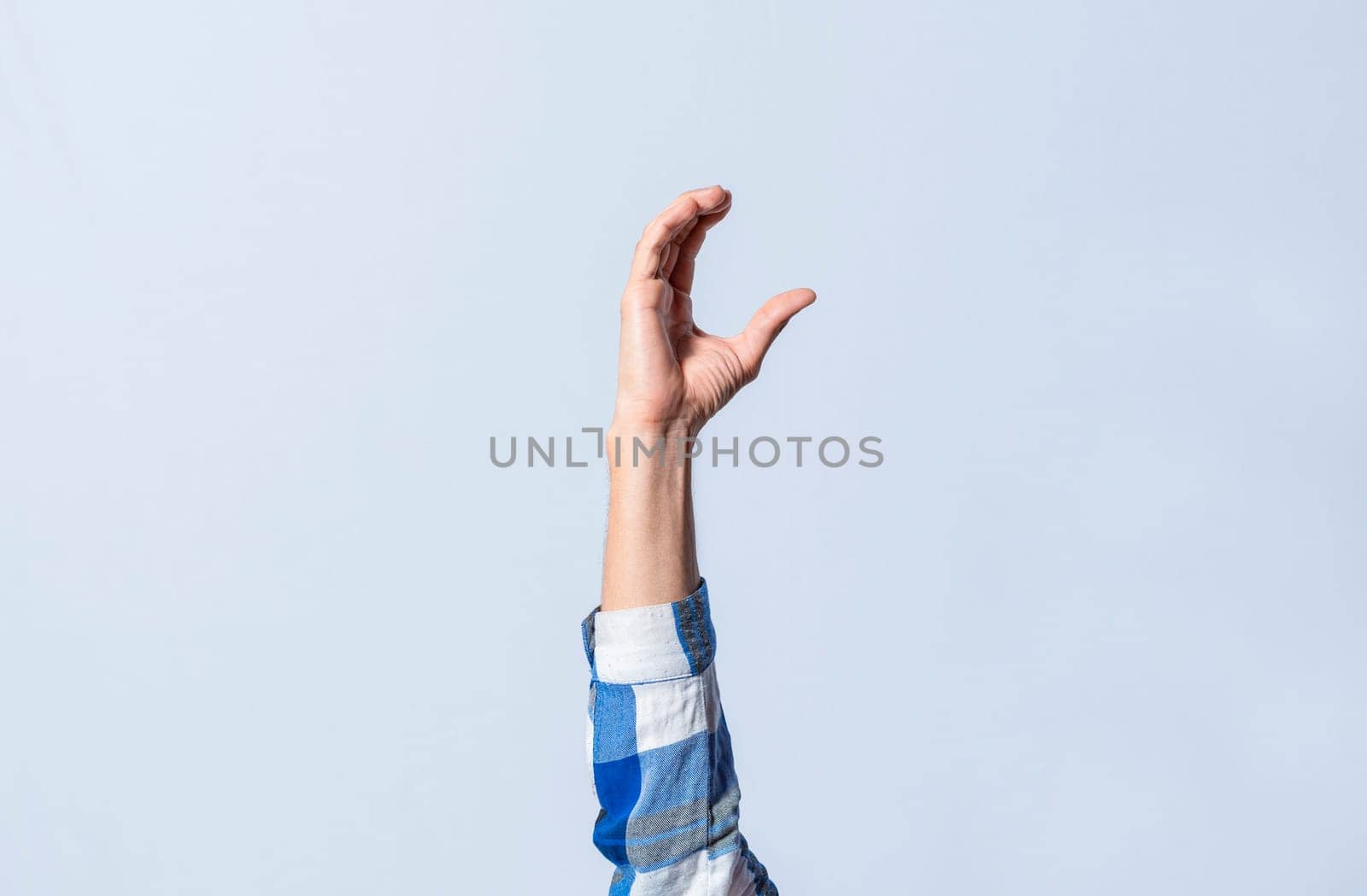 Hand gesturing the letter C in sign language on isolated background. Man hand gesturing letter C of alphabet isolated. Letters of the alphabet in sign language